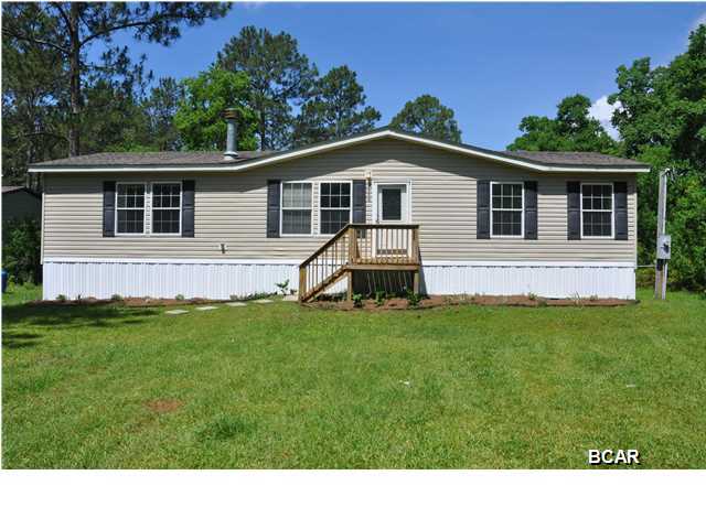 Don't miss this great opportunity to own a LIKE NEW, on-frame Florida modular, Horton home, in a neighborhood of lovely homes. This beauty has new flooring inside and new skirting outside. The cabinets and countertops are similar to those found in custom built homes and the open floorplan makes this home feel much larger than it is. The master bath is a full 5 piece ensuite, complete with garden tub. This is a 2004 home, but you'll be surprised at how NEW this home feels. The home is situated perfectly, on the sunny 1 acre lot, making it easy to add 1 or two more homes, perfect for the large family. Since this is DCA modular construction, this home qualifies for Ship funds. (All info is approximate. Buyer to verify any and ALL info/dimensions/zoning, etc, that is important.)