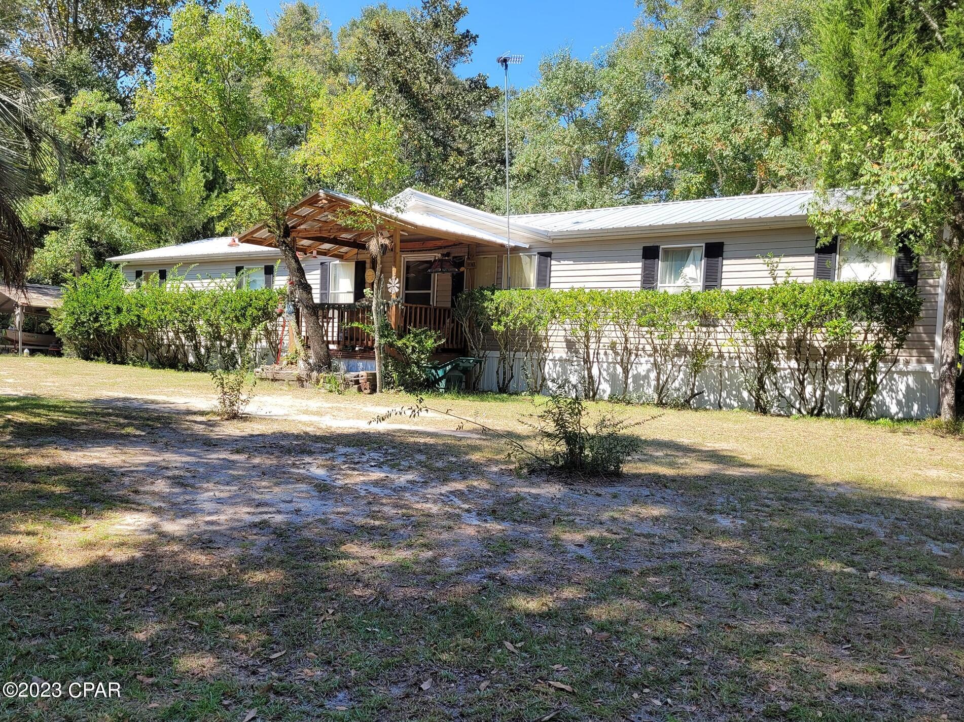 24X68 Pioneer Homes Doublewide on 4 acres in the country. Large fenced pasture and entire acreage is high and dry. 4-bedroom, 2 full bath home sits on a concrete slab. New metal roof in 2021 and the HVAC is approximately 5 years old. Huge 24x12 master bedroom with 2 large walk-in closets. The master bath has a garden tub and a new shower. Covered front porch and large covered deck on the back for enjoying the scenery and grilling. Detached 24X24 carport, a 20X18 barn/garage with a concrete floor and attached chicken coop, and a 10X16 metal building with electric. Minutes to a nice boat ramp on the Choctawhatchee River and to Geneva, AL shopping. 1 Hour, 20 minutes to Panama City Beaches.