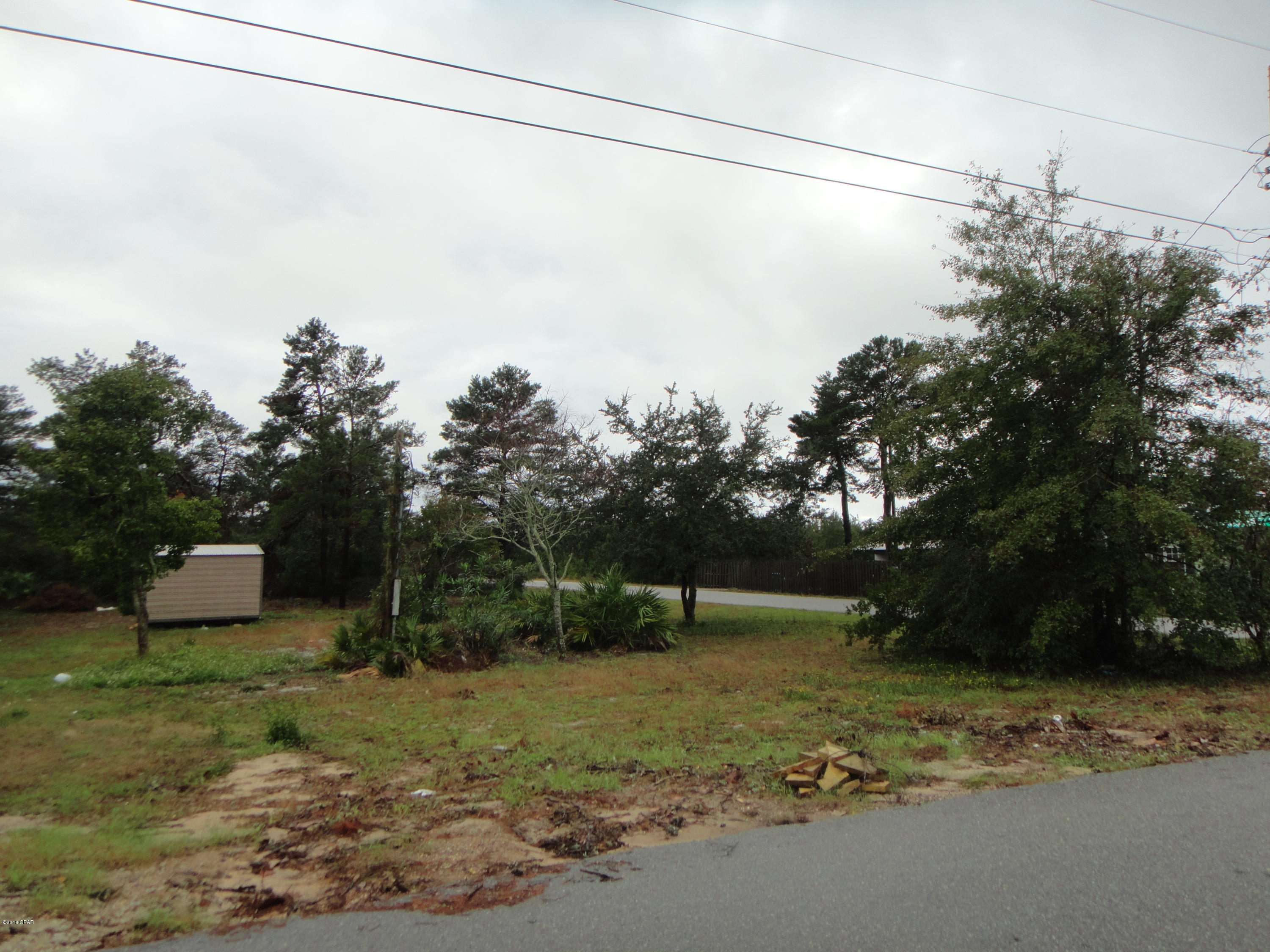 Corner lot in mobile home estate.  Only a few blocks from the beach.  Great location for a mobile home, close to restaurants and shops.
