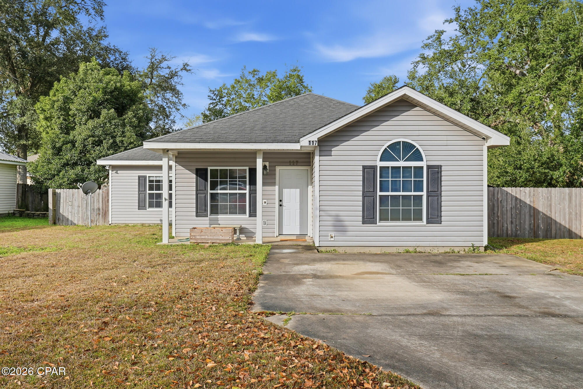 Welcome home to Oak Gardens II located in Wewahitchka, Florida. This charming single-family home offers 3 bedrooms and 2 bathrooms, set in a quiet neighborhood convenient to town, outdoor recreation, fishing and the beaches of Port St Joe. Step inside to an inviting open-concept living area that flows into the kitchen and dining space, creating an ideal layout for everyday living or entertaining. The home offers nearly 1,600 square feet of heated and cooled space, providing a comfortable, easy-to-maintain footprint. Three well-sized bedrooms, including a primary suite with its own full bathroom. Two full bathrooms total with a practical layout for families, guests, or roommates. Central heating and cooling and a traditional single-story floor plan that enhances accessibility and comfort. The lot is located on a cleared residential lot on a cul-de-sac street, offering reduced traffic and a more private setting and the exterior boasts a wood privacy fencing and a shingle roof add to both function and curb appeal. Driveway parking and a standard yard size give room for kids, pets, or a small garden without excessive upkeep. Situated in Wewahitchka, known for its small-town feel and proximity to the Dead Lakes, popular for fishing and boating. Reasonable driving distance to Port St. Joe, Mexico Beach, and Gulf Coast beaches for work, shopping, or weekend trips!
