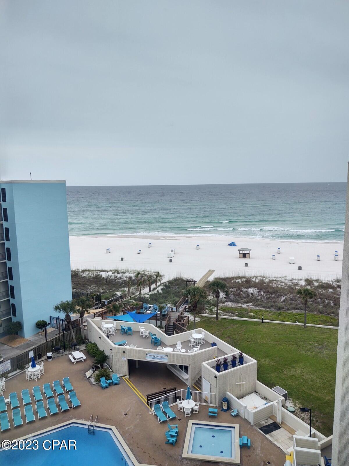 BACK ON THE MARKET! No fault of the sellers. Condo appraised at $285000 and cleared inspection, here's your chance to own this spectacular top floor Condo! When you step inside you will see that it has  been transformed into one of nicest units at Top of The Gulf Beach Resort.
 This top floor gulf front condo has breathtaking views of the Gulf from the unit as well as having the beds situated strategically for those awe inspiring morning wake up views! This completely updated unit is facing the Gulf of Mexico not the street side of the building. Pet friendly for owners! The low HOA fees and NO Assessment fees make this a smart move for the savvy buyer. Truly a turn key rental ready unit with a good rental history.Some interior features include new quartz countertops,new cabinetry kitchen as well as bathroom area,new subway tile new shiplap wall treatments, two new queen beds as well as a pullout sofa, new dresser and end table and more! Same floor laundry room. The Resort features a poolside bar & snack shack, gulf front pool,grilling area, beach service to name a few. The resort is very well maintained and the building has all new high impact glass on all windows, new paint and new roof. The resort is Conveniently located to attractions,dining the State Park and shopping. Financing is available with listing agents preferred local lender.
