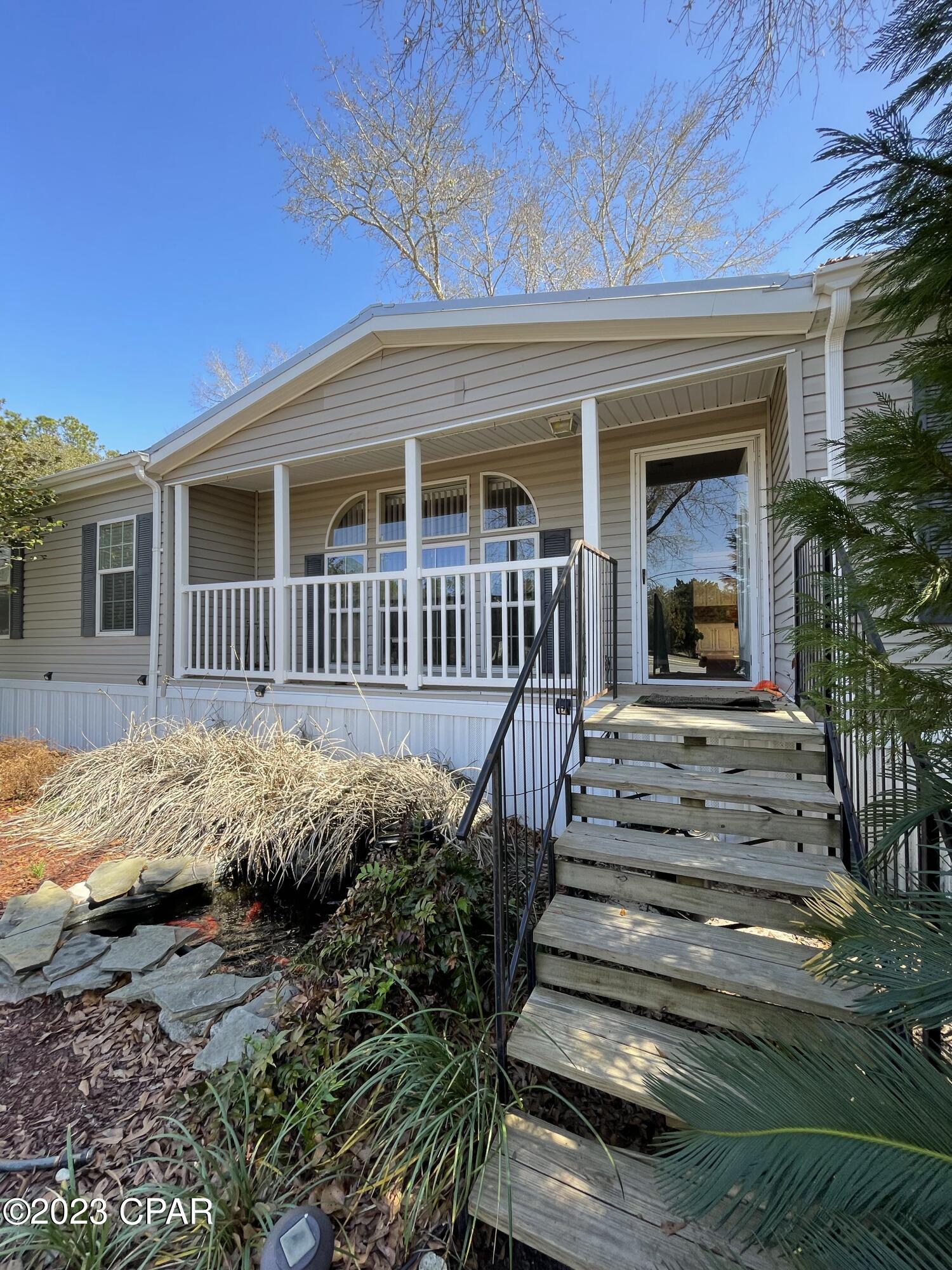Don't wait to view this charming, well kept home with approx 270 ft of frontage on Hwy 79. Upon entry you will find 4 bedrooms, 3 full baths and 2,291sqft. This home offers 2 large living spaces with a fire place and a spacious kitchen/dining room. The main suite includes large closet and en suite, as well as a flex space. There are 3 more bedrooms and 2 other bathrooms that complete this house. The property is almost an acre and has been well maintained.  There are 2 large sheds behind the house. This property is approx 15-20 minutes away from Pier Park, Panama City Beach and 30A. All sizes are approximate and should be verified by Bay County Property Appraiser or by buyer.