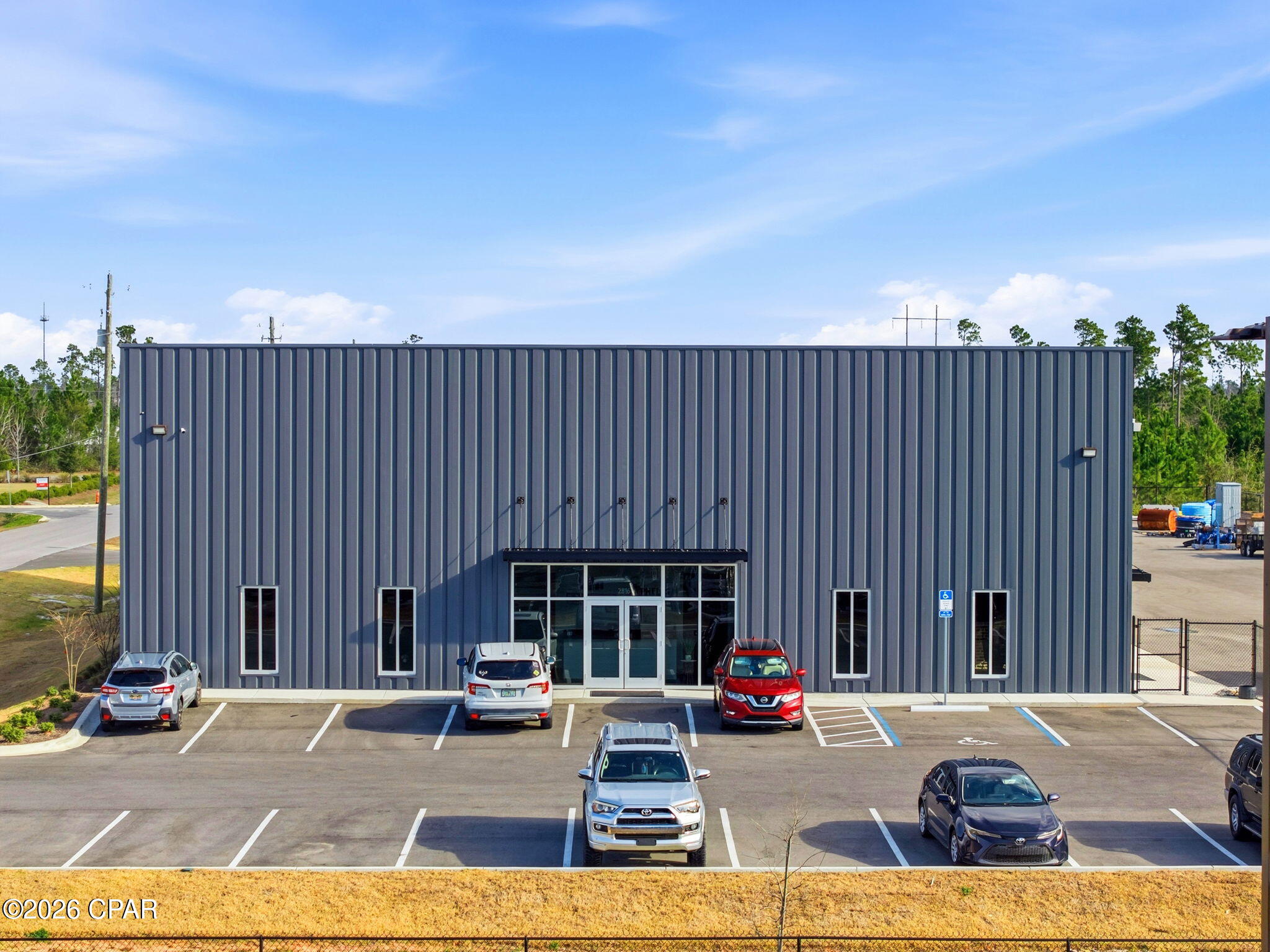 Prime commercial warehouse opportunity at 2816 Forester Trail in Cedar Grove Commerce Park of Panama City, FL! Built in 2025, this impressive 11,920SF facility sits on approximately 2 acres and features 27 paved parking spaces, with the entire parking area and lay down yard fully asphalt paved, as well as being completely fenced and gated. The property offers two points of ingress and egress, allowing for easy semi-truck access and deliveries without the need to turn around. The building includes approximately 4,067SF of heated and cooled finished office space, 7,853SF of open warehouse storage, and 4,067SF of mezzanine space located above the office area. The warehouse offers a sloped clear height ranging from approximately 16 feet on the low side to 20 feet on the high side, providing excellent vertical storage capability, and is equipped with four oversized 16-foot roll-up doors for easy access and efficient operations.

Inside, the office space showcases beautiful LVP flooring, high ceilings, and recessed lighting throughout, and includes 11 private offices, a large conference room, a full kitchen, his and hers common bathrooms, and two executive offices with private bathroom access featuring walk-in shower. This versatile property is ideal for a variety of commercial or industrial uses.