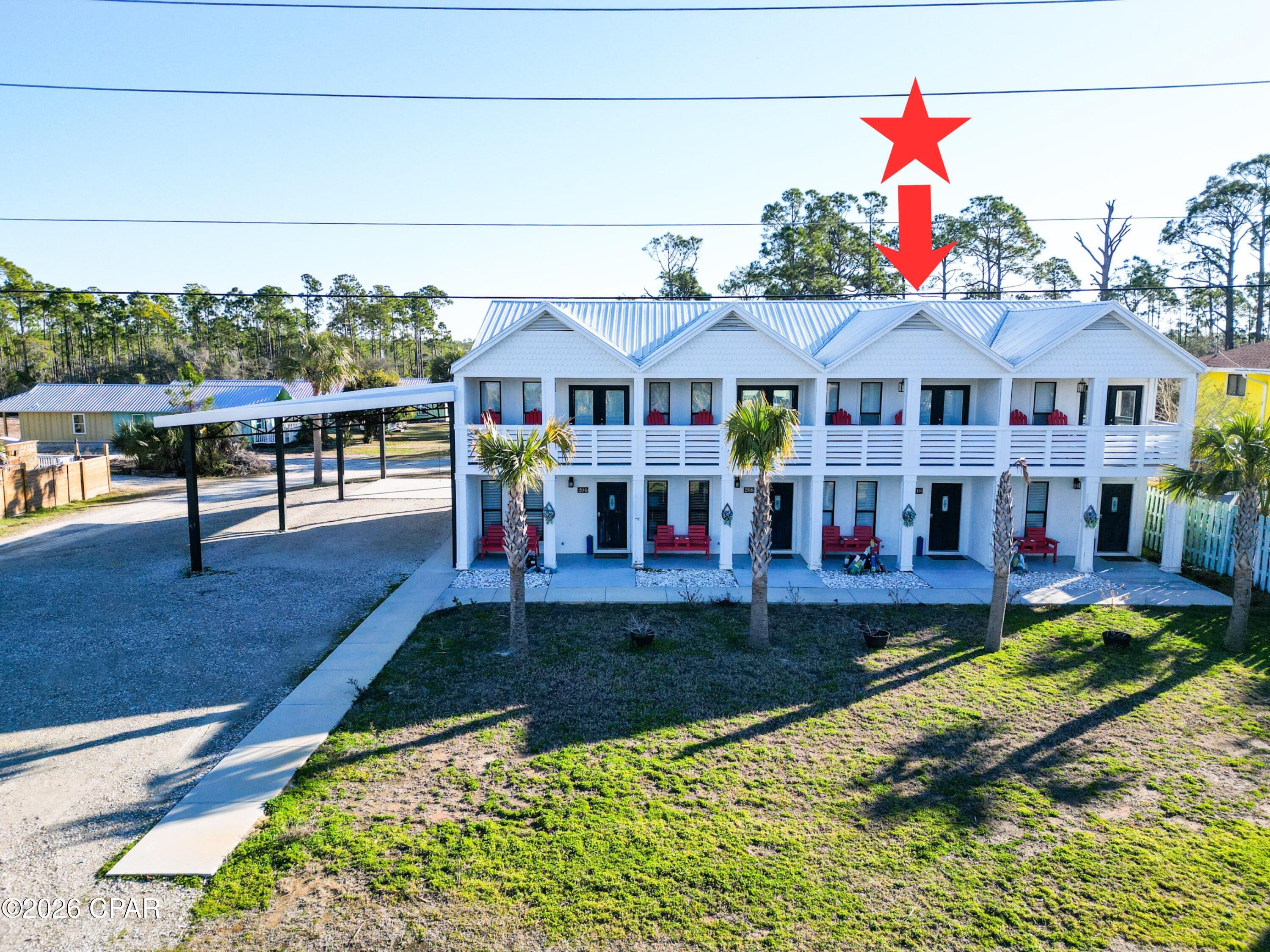 Turn key unit is part of a quadplex across the street from the Gulf of America. Each unit is a 2 bedroom 1 full and 1/2 bath with an open floor plan and gulf views. These completely furnished units have a covered front porch, second story covered deck off of a top bedroom with Gulf of America views. Need to entertain or just want extra space? There is a spacious back patio that is partitioned for privacy, large back yard, and side covered parking gives the property many options for added features or expansion versus similar beach multi unit residences. There is a recorded beach access pedestrian easement for easy beach access right across the street. Conveniently located equidistant between Port St Joe and Mexico Beach for a variety entertainment options. The subdivision is decades old and has its own ingress and egress road with no thru traffic. NO HOA!! All units are in an X flood zone per the Gulf PA website, Verify if important. Some dimensions taken from the Gulf County Property Appraiser's website, please verify if important.