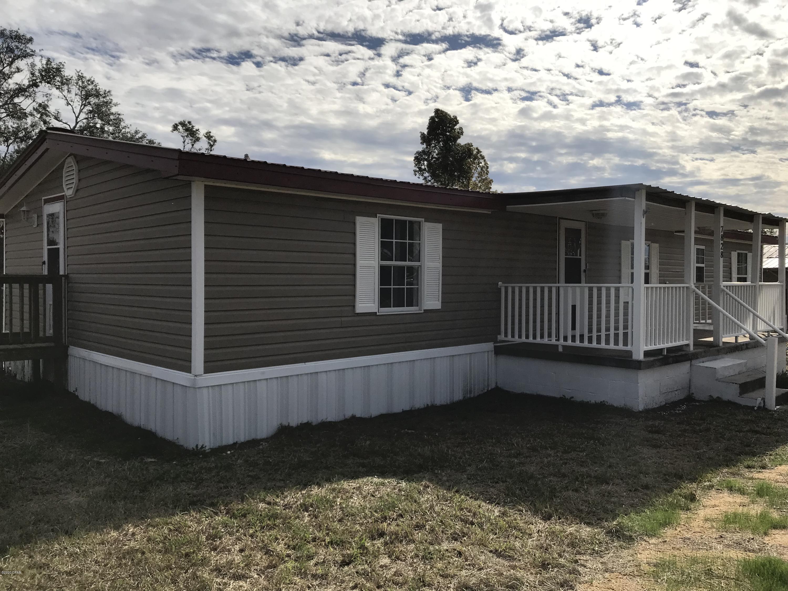 This 3 bedroom 2 bath double wide mobile home is located on a 0.18 lot with back yard chain link fence ready for your beloved dog to run and play. The master bedroom has wood burning fireplace, large walk in shower and walk in closet. Spacious screened in back deck and cozy front porch for your porch swing and rocking chairs.  Kitchen has stainless steel appliances, oak cabinets and washer and dryer all included .  Breakfast nook and eat at bar.  

Great house waiting for someone to make it their home.