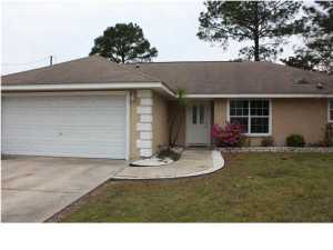 Great location to beaches yet in a quiet residential area. Home has large living area, dining area, and breakfast bar. Open floor plan with no wasted space. Split bedroom plan, Master suite has walk-in closet. Low maintenance, Stucco, and corian window sills. Converted garage into large Master Bedroom. Key in office.