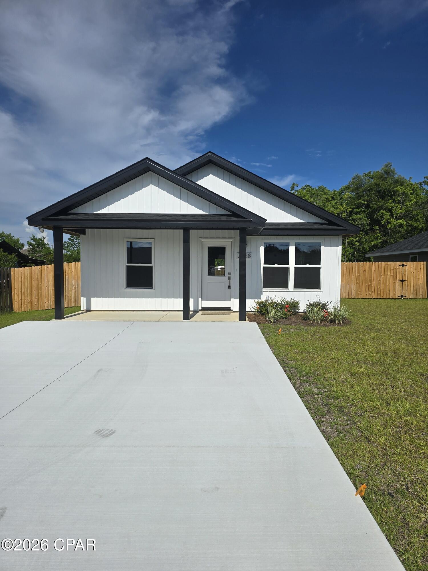 New 3 bdrm 2 bath home with LVP and cathedral ceilings in the living area.  Nice kitchen with granite breakfast bar.  Lovely starter home with two bathrooms and a partially fenced yard.  It is just off Hwy 231 with great access to shopping and places of interest.  Just 1.2 miles to 23rd Street for all your shopping needs. Large living dining area provides space for the family to gather.  The rear 120 (approx.) feet of this lot is wetlands.  But it is in Flood Zone X.