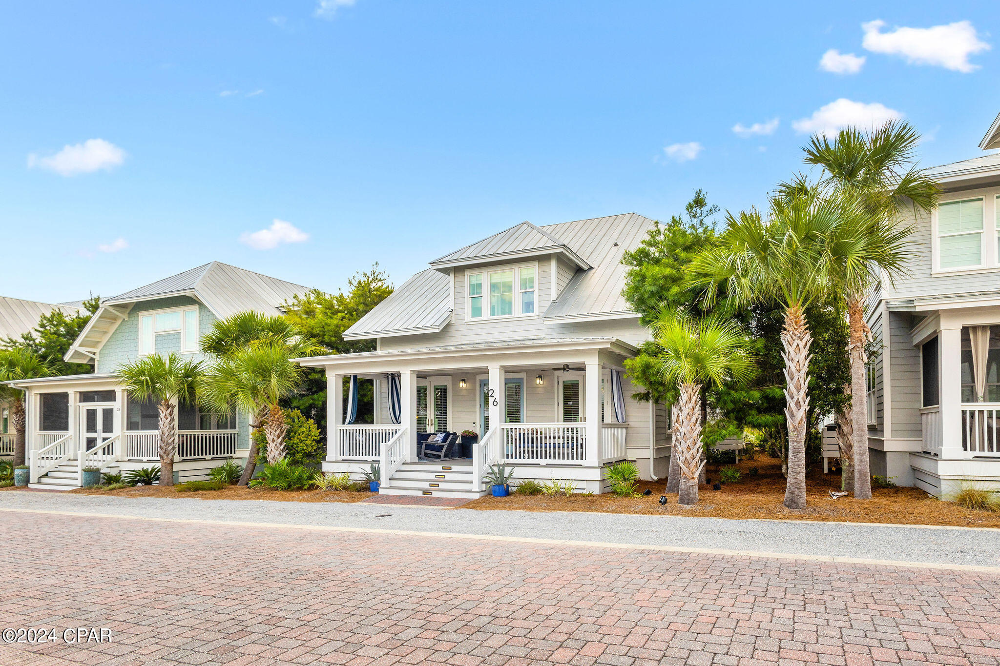 Waltz back in time to experience carefree days and front porch hellos with a more relaxed lifestyle... Welcome to 26 Federal Street, where Classic Americana meets Modern Luxury. This quintessential beach cottage on the most peaceful street in the neighborhood is perfect for a primary or secondary residence, and an incredible investment opportunity with yearly rental projections of up to $140,000. Elegantly decorated, this home comes FULLY FURNISHED. Enjoy beautiful hardwood floors, stone countertops, 10-12 foot ceilings, 8-foot doors, and unique design details at every turn. With 3 bedrooms and a bonus bunk room, this gem comfortably sleeps 10+ guests. It boasts a dreamy front porch, a detached TRUE 2-car garage, an outdoor shower, and beautiful landscaping. This dream home is turn key ready and truly has it all. Prominence on 30A is THE PLACE for those wanting to experience the area with easy access to new and longtime 30A attractions along the stunning white beaches of The Panhandle. Prominence features incredible amenities, open green spaces, over 17 miles of bike paths, a beautiful town center, and 2 resort-style pools. The Big Chill, a popular entertainment spot, offers an outdoor 25 ft LED theater screen hosting concerts, sporting events, movie nights, activities, restaurants, and boutique shops. Prominence is ideally situated between Seaside & Seagrove Beach to the west and Alys and Rosemary to the east, just 20 minutes from Pier Park. Life is meant to be experienced and 26 Federal Street is ready for you!