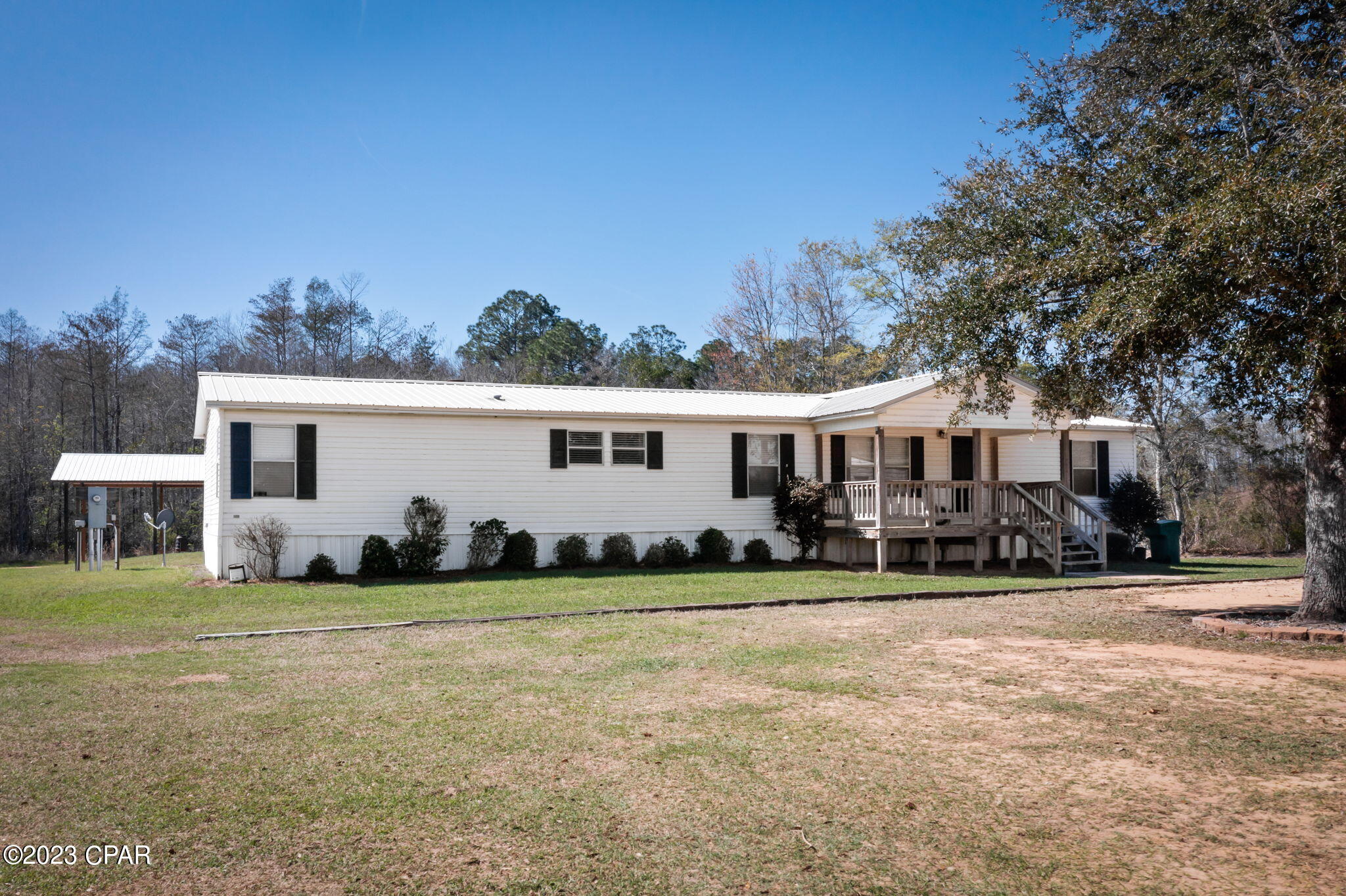 ''CURRENTLY UNDER CONTRACT, SELLER WILL CONSIDER BACKUP OFFERS'' SELLERS MOTIVATED!!!!  Country Living at its best!! This 4 bed/ 2 bath DWMH is Move-In Ready!  Open concept and split floor plan. Spacious Living Room open to the Dining Area. Separate large Family Room, complete with fireplace, open to the Kitchen that features lots of cabinets and eat-in bar.  Master bedroom has oversized connecting room that could serve as office/nursery.  Master bath features double vanity.  Outside features include backyard partially chain link fenced-in, pole barn, workshop with electricity and water and storage building.  All of this and so much more sitting on 2.5 acres with no restrictions.  Don't miss out, call today to schedule your personal viewing!