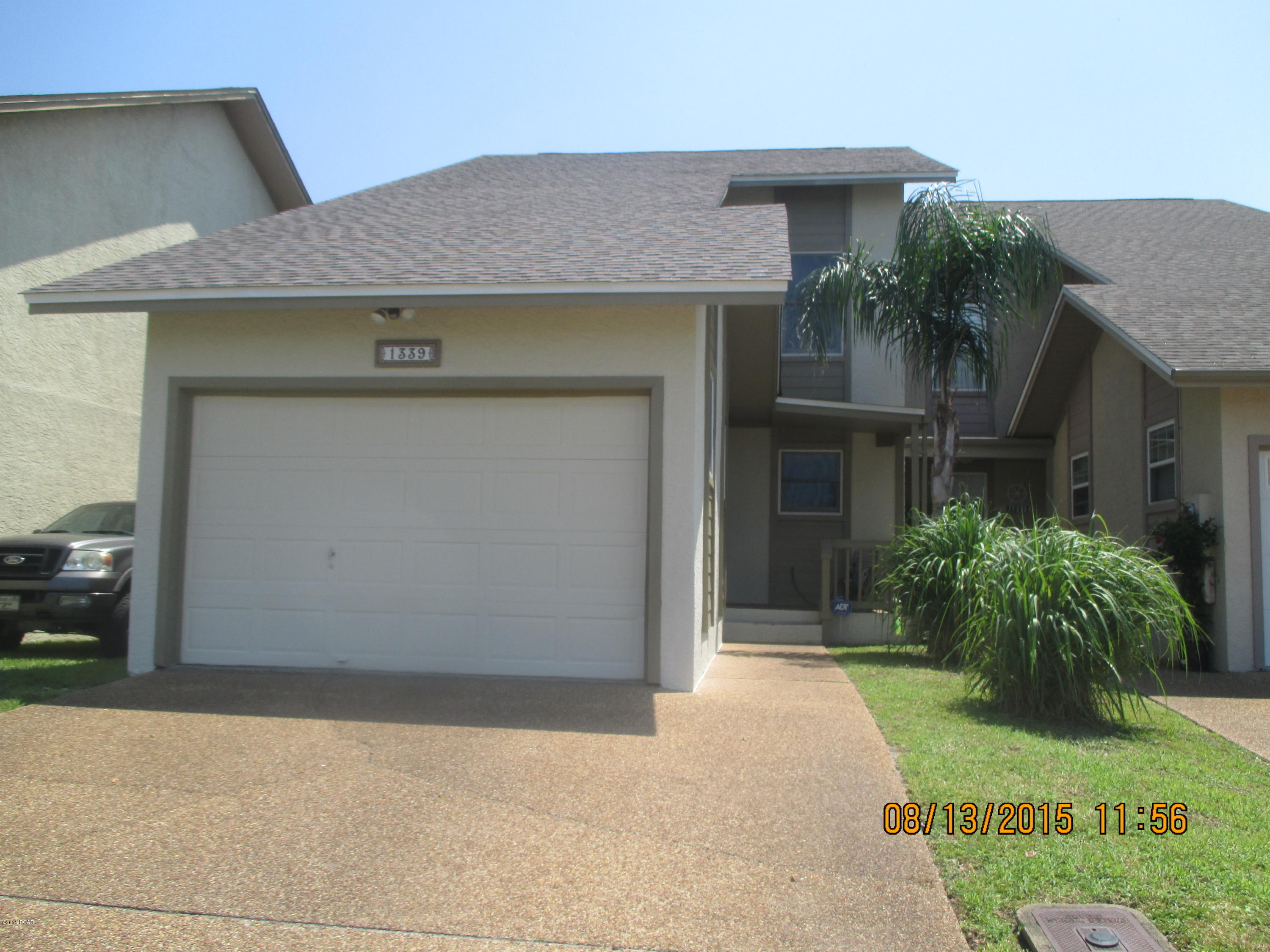 Incredible WATERFRONT town home with gulf, deep water access under $200,000 THIS is a rare END UNIT that has one of the best water views from two balconies and gives you 30 FEET of canal frontage.  A 3 bedroom 2 1/2 bath with over 1572 square feet is perfect for someone that wants to be on the water. The living room is open with cozy stone fireplace and beautiful views of the water. The kitchen is tile and features all appliances including the refrigerator and a breakfast bar. There are three bedrooms upstairs with the master bedroom featuring a covered balcony overlooking the canal. This unit has been recently painted. A brand new roof has just been installed! The HVAC was replaced in 2013, new carpeting was just installed and new tile in the bathrooms. The home features, Anderson windows with 3M film/tinting, a spacious garage with large attic, private backyard, and sprinkler system. The dock has  electricity and water. This is a move-in ready home that has so much to offer for the water enthusiast. Preview this home and you will be not be disappointed. MOVE-IN IMMEDIATELY AND LIVE ON THE WATER TODAY ALL AT A GREAT PRICE!