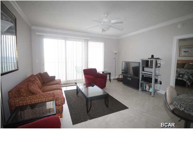 This beautiful 8th floor unit is located on the quiet east end of Panama City Beach near St. Andrews state park. This oversized two bedrooms/bunk area/two bathrooms unit has 1,370 square feet with ceramic tile flooring throughout. The 270 square foot Gulf front balcony is accessible by sliders from the master and the great room. Ceilings are 9 foot with crown moldings and four ceiling fans. Features include central air and heat, granite counter tops, cultured marble bath vanities and showers. Association fees provide high speed wireless Internet, cable TV, trash, water, and sewer. The condo is sold fully furnished and decorated in the contemporary style with high quality framed art. It is turnkey ready for rentals. This condo has been no smoking and no pets since it was opened new  in 2005. The 120 foot long Gulf front pool is heated year round and the pool deck has lounge chairs, gazebos, and bar-be-que grills. There is a well equipped fitness room with cable TV, and a spacious owners lounge available to reserve for private parties. There is an attached garage with covered parking and a designated private space. All information is believed to be correct but should be verified.