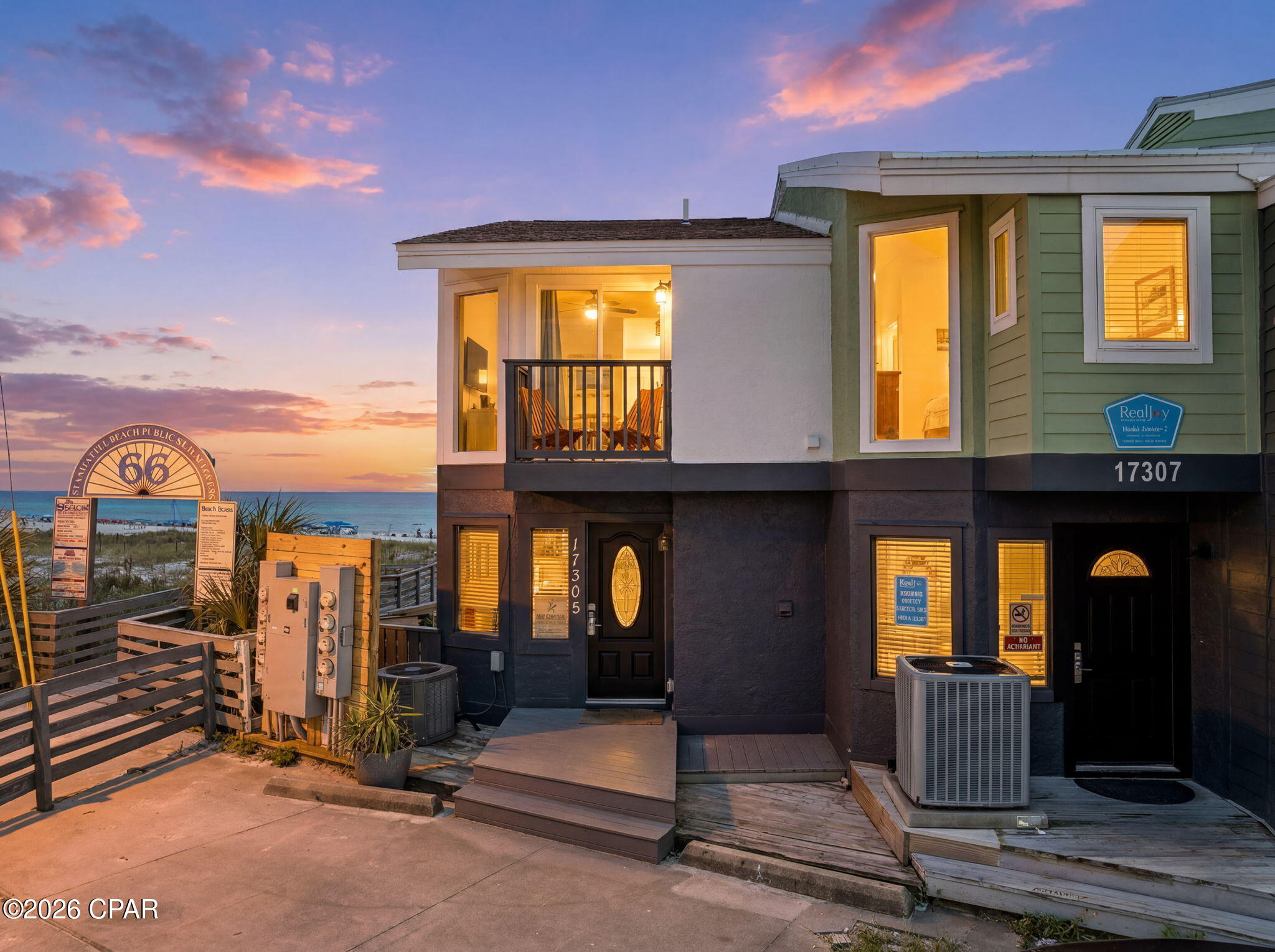 Blue Surf Townhomes is positioned on the west end of Panama City Beach near the South Walton line, offering a rare beachfront end-unit opportunity with direct Gulf access. This 2BR/2BA residence sits on a generous beachfront lot with unobstructed water views and immediate access to the sand from a private elevated deck and stairway leading directly to the Gulf. The interior has been thoughtfully updated with an open-concept kitchen, granite countertops, upgraded cabinetry, and refreshed flooring throughout. Large wall-to-wall windows maximize natural light and frame panoramic Gulf views from the main living areas. Both bedrooms are located on the second level, each with balcony access and coastal views, complemented by a shared full bath. Recent improvements include a new roof, updated flooring, fresh interior paint, and enhanced exterior concrete parking area. The property also benefits from ample on-site parking and a low-maintenance coastal layout. With no HOA restrictions and strong short-term rental potential, this property offers flexibility as a primary residence, second home, or income-producing investment in one of the most desirable stretches of the Emerald Coast. Its proximity to Pier Park, 30A, Northwest Florida Beaches International Airport, and surrounding dining and entertainment further enhances its long-term appeal. A true beachfront offering with limited comparable inventory--rarely available and highly sought after for both lifestyle and investment use.