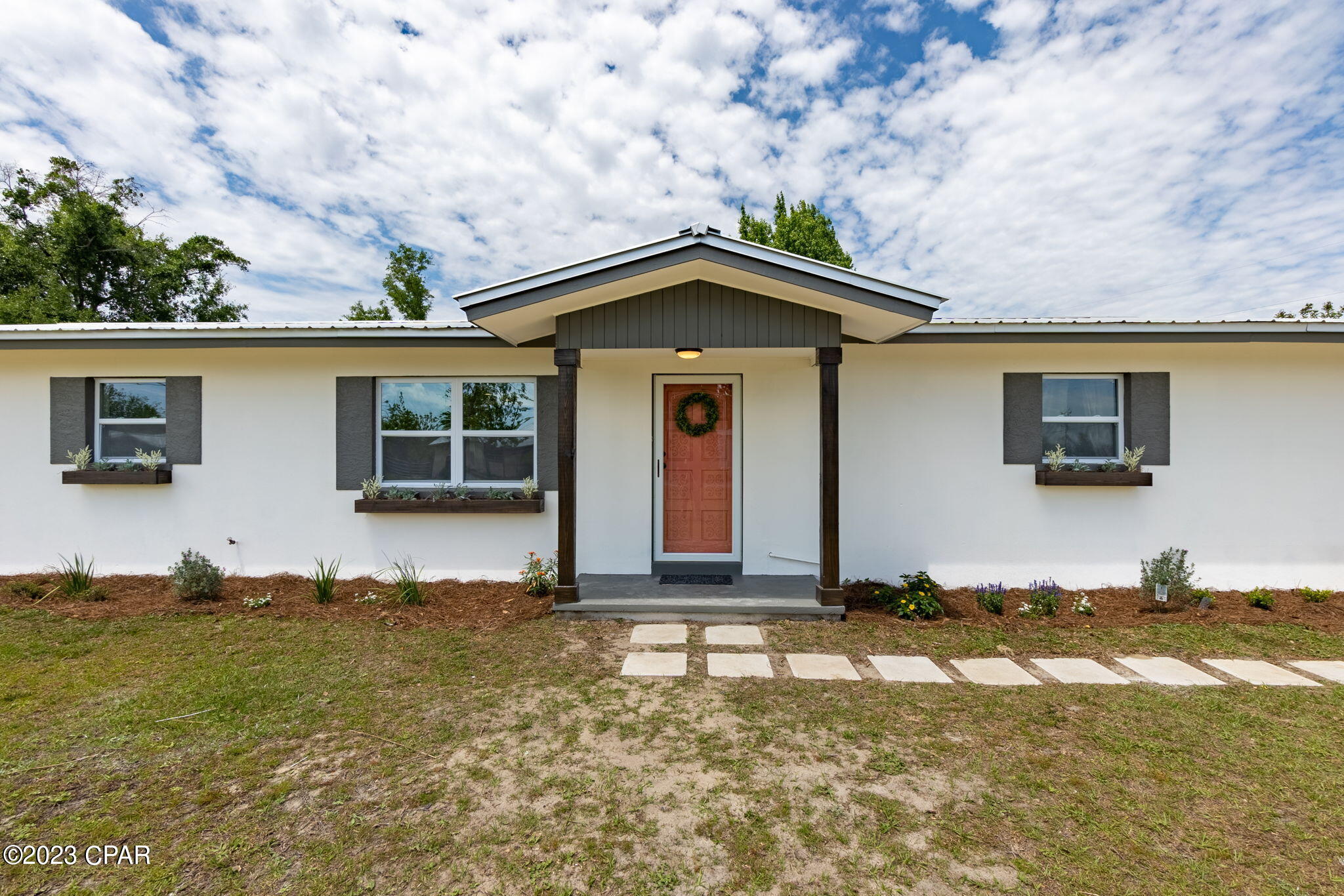Currently under contract taking back up offers. Come see this beautifully remodeled home! Home was taken down to the studs and completely rehabbed. Roof, HVAC, and hot water heater less than 5 years old. New windows throughout. New kitchen with an 8' x 4' granite bar. New cabinets with granite countertops, new stainless steel LG appliances, stainless steel farmhouse sink, even a pot filler! Both bathrooms have new cabinets and master bath has a tile walk-in shower. Master bedroom boasts a huge walk-in closet with mini chandelier. Home has new LVP flooring throughout, interior doors, and new interior and exterior paint. There is a concrete pad ready for a detached garage or workshop. Lot is .5 acre and is fenced. Most of the interior plumbing and wiring is also new. this home is on well and septic with a water softener that is owned by the seller and will stay with the property but the public water and sewer tap is right next to the property and can be accessed.All measurements are approximate and should be measured if important.