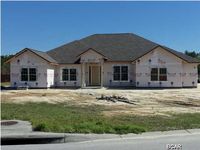 New construction in the well received Meadows subdivision in Lynn Haven. The Meadows is also home to Nature's Walk Executive Golf Course. Home features all brick siding with stacked stone accents. All counter tops and vanity tops are granite. Home is featured on large corner lot. Home is under construction and should be finished in August. Listing agent can provide contact information for the contractor. Interior flooring is engineered hardwood in great room, 10 ft ceiling in main living area, entry, dining, and kitchen tile in entry, kitchen, and baths. Great room and master bedroom have tray ceiling. Master bath features very large walk-in closet just for her and separate closet for him. There is still time to pick flooring, colors, granite, and cabinets. Please contact Realtor