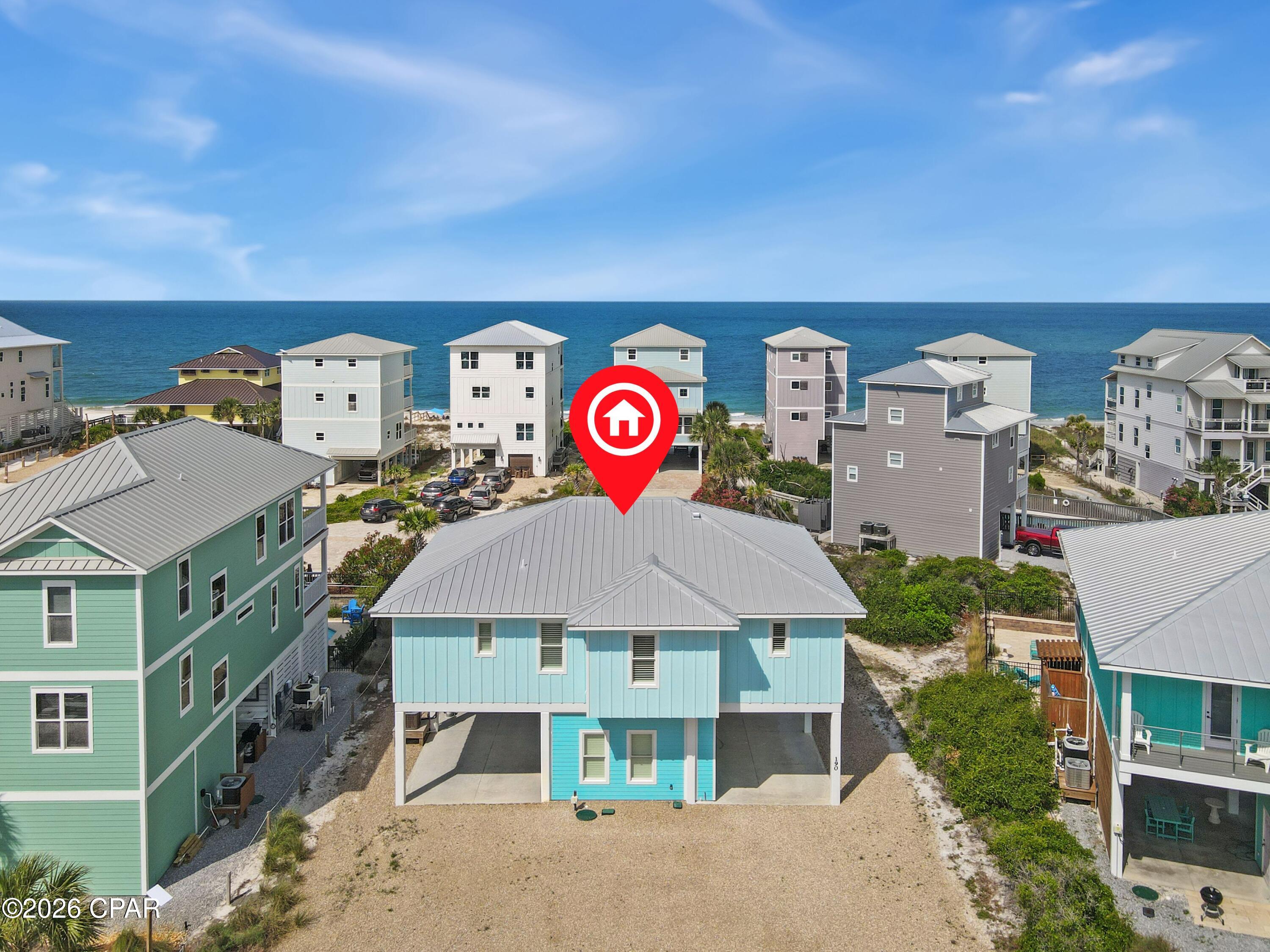 The best of coastal living can be found in this stunning 2023 beach home on beautiful Cape San Blas, where spectacular Gulf views, modern luxury, and timeless coastal design come together. Featuring 4 bedrooms, 3.5 bathrooms, and a private saltwater heated pool, this thoughtfully designed home offers the perfect retreat for full-time living, vacation escapes, or an exceptional rental investment. The open-concept living area is filled with natural light and showcases gorgeous shiplap accent walls, seamlessly connecting the spacious living room, dining area, and kitchen. The kitchen is beautifully appointed with quartz countertops, stainless steel appliances, a wine refrigerator, and ample space for entertaining family and friends. Directly off living space, step onto the screened porch to relax with your morning coffee or unwind while taking in breathtaking Gulf views and unforgettable sunsets. Designed with both comfort and convenience in mind, the home also features a private elevator, standing seam metal roof, Hardie siding, and an outdoor shower to rinse off after a day at the beach. A full bathroom on the ground level offers easy access from the pool area, making outdoor entertaining effortless. The large parking area is convenient for those with a boat to park and turn around, house also features 240 volt hookup for car chargers or RV on each side of parking underneath house, RV hook-up for power, water and sewer on-site. Located on the highly sought-after Cape San Blas, you'll enjoy sugar-white sand beaches, world-class fishing, kayaking, shelling, and some of the most beautiful sunsets on Florida's Forgotten Coast. Just a short drive away, downtown Port St. Joe offers charming boutiques, local restaurants, live music, and everything you need to complete the perfect coastal lifestyle.