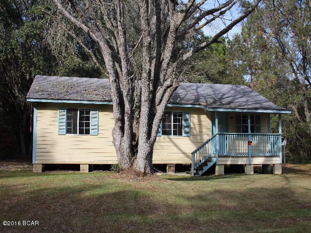 PRICE REDUCTION!! Cottage in the country surrounded by woods and wild life. The house has a wood picket fenced in back yard just right for a place for the kiddies to play in. There is a detached metal carport and a metal utility shed. Ownership of this property provides numerous amenities to Compass Lake in the Hills that include access to two lakes, club house facilities, golf driving range, swimming pool, RV Parking spaces, cottage rentals, horseback riding and more! THe POA fees are only $135 per year and are included in the property tax bill.