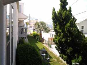 Open House NOV 9TH 1 TO 3 PM, if it lasts that long!!!!!! RECENT REDUCTION SHOWS THESE SELLERS ARE SERIOUS ABOUT SELLING! This condo is in GREAT shape, All furnishings convey (please see photos). Owners have not rented out this unit and they have taken really good care of it so please put this on your must see list! Peek a boo view of the gulf from the private balcony located on side of complex, this balcony is located by a nice shade tree and is secluded from the street but still has a great gulf breeze. Huge bedroom with two full beds and an open floor plan in the living dining and kitchen area make the home feel so much bigger. The bathroom is accessible from the master and the hallway.