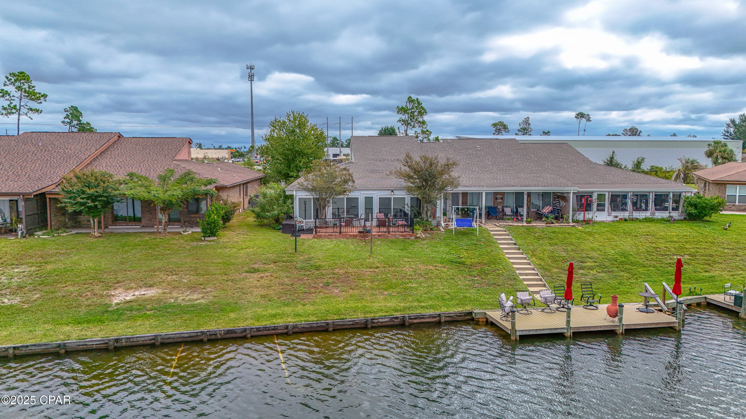 LAKE MARIN WATERFRONT TOWNHOUSE!!! These do not come up very often. Don't miss your chance! The interior of this home features 2 spacious bedrooms, 2 bathrooms, a bonus room/loft, crown molding, a vaulted ceiling, an updated kitchen with granite, an interior laundry area, a large sunroom, an open floor plan, and an attached garage. The kitchen has a breakfast bar, ample counter and cabinet space, tile floors and a window overlooking the courtyard. The loft is accessed by spiral stairs and could be used as a bonus living room, 3rd bedroom (has 2 closets) or an office. The two bedrooms are large and each have adjoining bathrooms. The sunroom extends across the back of the house and overlooks the beautiful Lake Marin. The 2 car garage has built-in cabinets and pull-down stairs. The exterior features a gated courtyard and a sprinkler system. The sunroom was a favorite sitting place to entertain overlooking the beautiful Lake Marin! This unit had an immaculate owner! The community dock has just been redone. All ages, sizes and measurements approximate; buyer to verify if important.