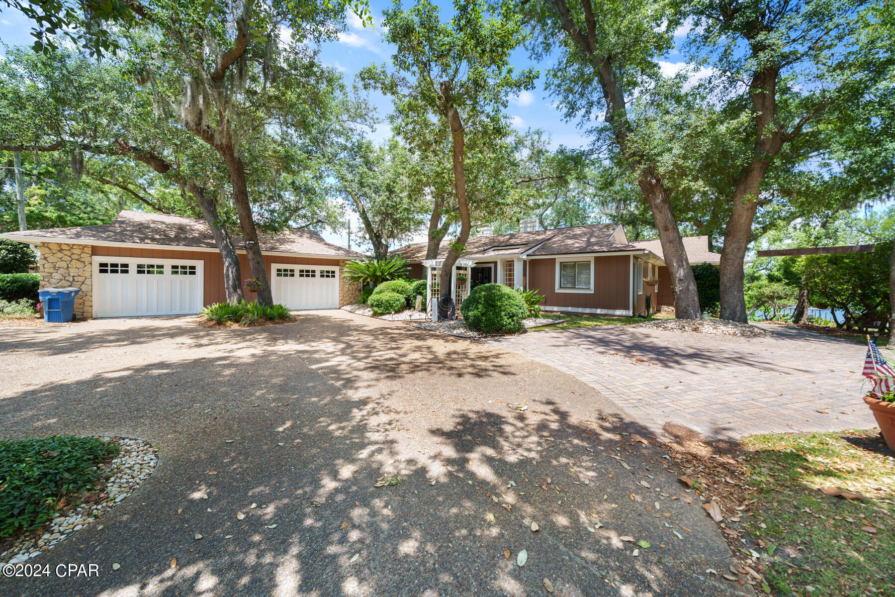 Charm meets luxury  - Waterfront Home in The Cove!

Seller is offering a $20,000 flooring and paint credit! 
Nestled in the heart of The Cove, this unique waterfront property exudes charm and character, offering numerous upgrades and modern amenities. With stunning bayou views and thoughtful design elements throughout, this home is a must-see.

Interior Features:

	•	Executive Office: Located right off the main foyer, perfect for remote work or a private study.
	•	Oversized Family Room: Featuring exposed beamed cathedral ceilings, a cozy wood-burning fireplace, and a stone accent wall, creating a warm and inviting atmosphere.
	•	Sunken Living Room: Enjoy panoramic bayou views, travertine tile, and cathedral ceilings with a flexible layout, perfect for entertaining or relaxing.
	•	Gourmet Kitchen: Fully renovated with high-end finishes, including a marble waterfall island, custom cabinetry, and bamboo flooring. Equipped with Viking and Bosch appliances, a breakfast bar, and a spacious breakfast room, all with stunning water views.
	•	Butler's Pantry: Offering ample storage and prep space with granite countertops, a wine refrigerator, and an ice maker. Adjacent to the kitchen is a versatile space ideal for a home office or sitting room.
	•	Ample Storage: The oversized laundry room is designed for efficiency, with space for hanging, folding, sorting, and storing.

Primary Suite Retreat:
The primary suite is your personal haven, featuring breathtaking bayou views, access to a private screened patio, a luxurious California closet, a jacuzzi tub, steam sauna shower, and heated floors. Relax and unwind with every comfort at your fingertips.

Downstairs Features & Rental Potential:
The downstairs living quarters offer significant rental income potential with a projected income of over $30k per year. This area has its own private entrance, accessible from the right side of the home, allowing it to be rented out while you enjoy the main floor. The space includes a large living room with newer LVP flooring, a full kitchen with a custom Apalachicola pecky cypress bar, and direct patio access. It also includes two additional bedrooms and a full bath, ideal for guests or vacation rental use.

Exterior Features:

	•	Deep Water Access and an oversized dock, perfect for boating and water activities.
	•	A screened rear porch complete with a hot tub, outdoor grill, and a large storage room for boating equipment and lifejackets.

Don't miss the opportunity to own a home on one of the most desirable waterfront streets in town! Schedule your private showing today and experience waterfront living at its finest.