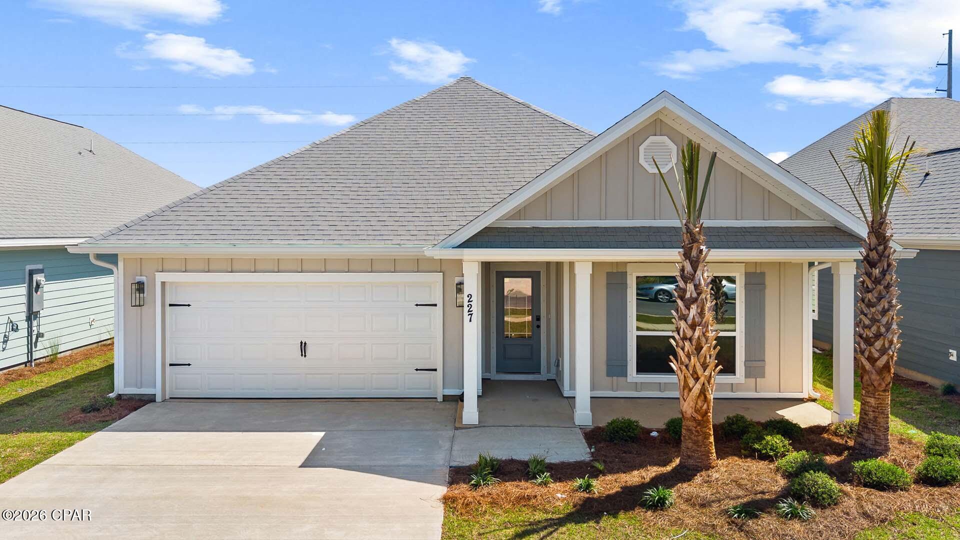Welcome to 227 Dama Del Mar Way, a new home at Caballeros Estates at Hombre in Panama City Beach, Florida. This single-family floor plan is under construction and is situated on a large lot just minutes from the beach. This home has four bedrooms, two full bathrooms and a single car garage.

As you enter this home you will find a bright entry with EVP flooring throughout the home. The foyer leads to the spacious living area that is designed for comfortable living. In the open concept living area you will find the kitchen with a center island that has space for seating. The kitchen has quartz countertops and white cabinetry for all your storage needs. A corner pantry allows space for your dry goods and small appliance storage. An appliance package is included with a stove, microwave and dishwasher. The primary bedroom is located off the living area it features EVP flooring, trey ceilings with a ceiling fan and an ensuite bathroom. The primary bath has a dual sink vanity with quartz countertops and lower storage drawers and cabinetry. There is a separate shower and soak tub as well as a large closet for your wardrobe needs. Each guest bedroom has EVP flooring and ample closet space. A shared bathroom has a vanity with quartz countertop and lower cabinetry for storage. Outside this home you will find a landscaped entry, 30-year dimensional shingles, and Hardie® exterior.