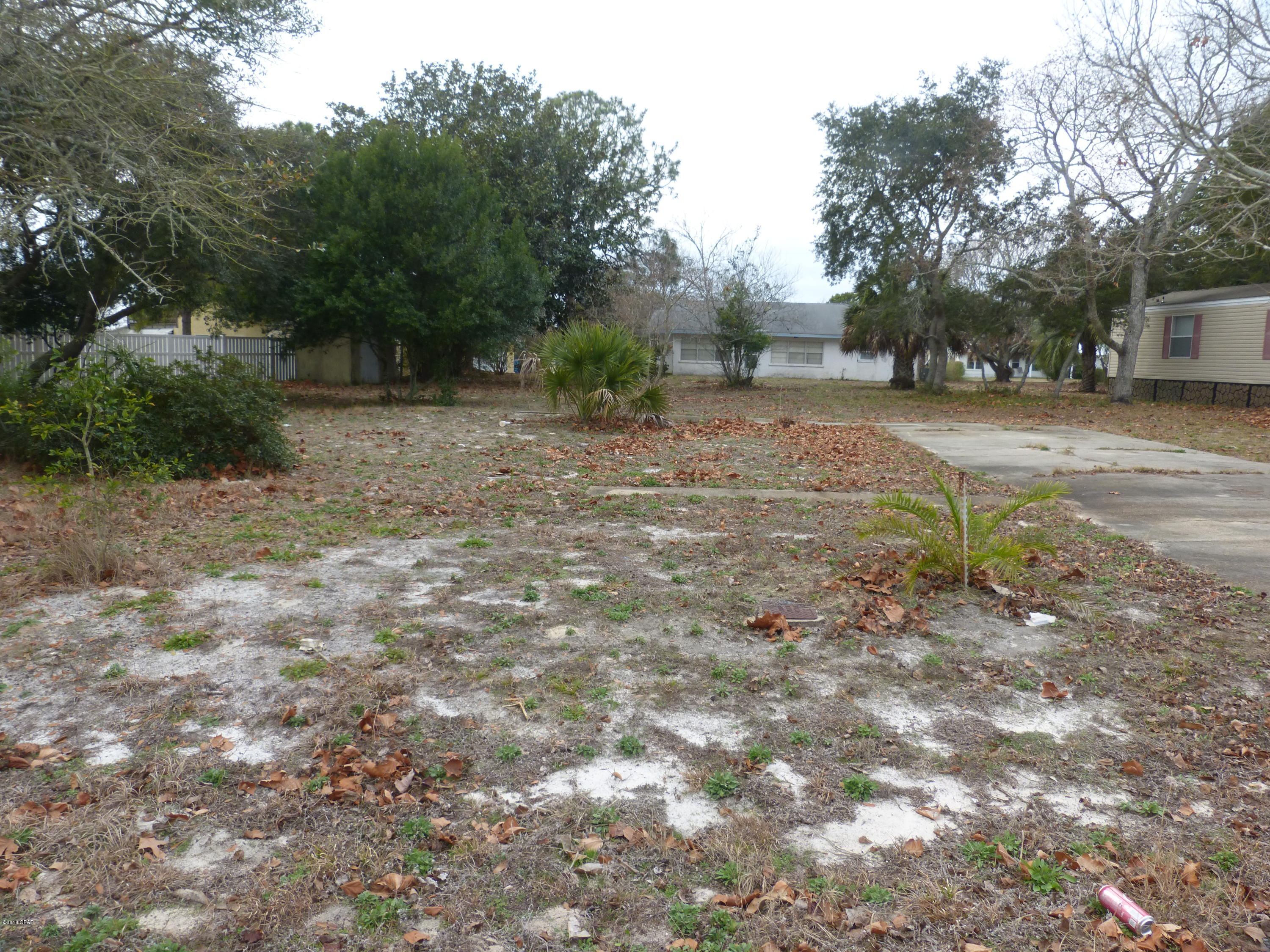 This beautiful lot is centrally located between Pier Park and Rosemary Beach, in quaint Laguna Beach approx. 0.2 miles from the worlds most beautiful beaches ''The Gulf of Mexico.''  On this cleared, R2 zoned, lot there is a driveway with a concrete slab, and septic stub.  Evidence of a prior dwelling potentially a mobile home.  Buyers due diligence regarding septic.  HOA fees optional.  Recent survey available for purchase.