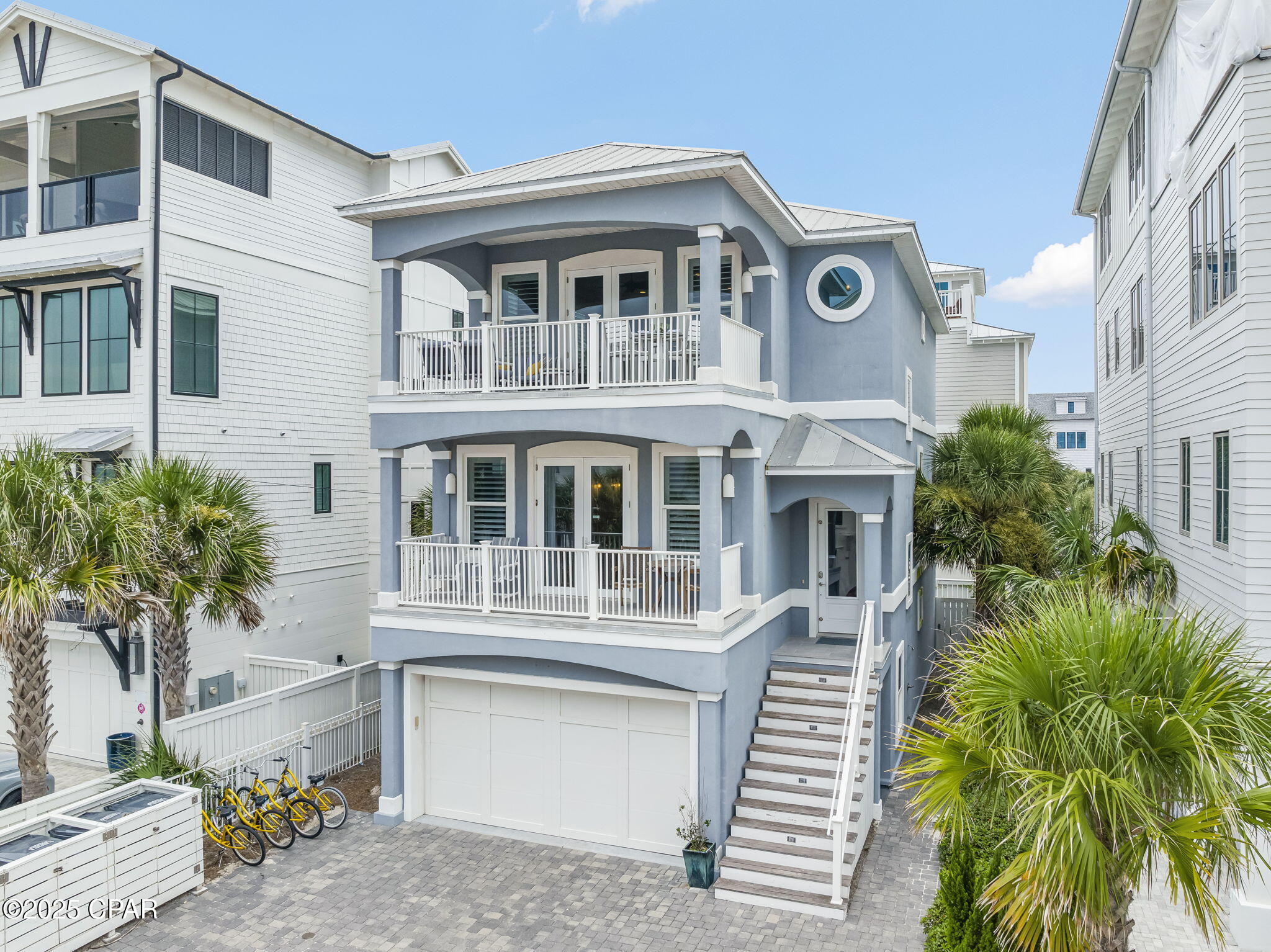 FABULOUS OCEAN VIEW! 175 FEET OF PRISTINE BEACHFRONT SHARED BY ONLY 14 HOMEOWNERS — NO CUSTOMARY USE ISSUES! This rare opportunity awaits at 93 Emerald Cove Lane, an exclusive coastal retreat in Inlet Beach with direct gated, deeded private beach access just one tier off the Gulf. Tucked inside a boutique HOA south of Highway 98/30A and less than a mile to Rosemary Beach (via convenient back roads), this 5-bedroom, 3.5-bath home blends luxury, strength, and effortless beachside living.

On the first floor, you'll immediately feel at home with light gray wood-tile flooring, soft blue shiplap accents, and an elevator that travels to all levels. This floor also includes a spacious guest suite with a fully remodeled bath featuring quartz countertops and custom tilework.

The shiplap continues up the stairways to the second floor, home to three bedrooms—including the true master retreat with a private lookout balcony and pristine Gulf views. The master showcases a wood accent wall, a Pecky Cypress barn door, a spa-like bath, and a fully built-out walk-in closet. Another full bath on this level continues the elegant coastal palette of blues, whites, and grays.

On the third floor, a light-filled open living space seamlessly connects the kitchen, dining, and living areas. Enjoy a gas fireplace, a cozy sitting room with French doors, and a redesigned chef's kitchen with stainless steel appliances. Step outside to the expansive balcony, perfectly positioned for breathtaking Gulf sunsets. This level also features an additional guest bedroom.

Forever-protected Gulf views stretch west over the state preserve, while the community pool is just steps away and rarely crowded. Built with ICF construction, this home is up to 10 times stronger and significantly more energy efficient than traditional builds. Additional upgrades include a backyard fenced patio, driveway pavers, and a refinished oversized garage with parking for 3-4 cars plus space for 3 more outside.

Ideally located in Inlet Beach, just east of Rosemary Beach and minutes from the boutiques and dining of 30 Avenue, this immaculate home is in like-new condition and would make a perfect full-time residence, second home, or investment property. Don't miss this rare chance to experience the very best of coastal luxury living along 30A.