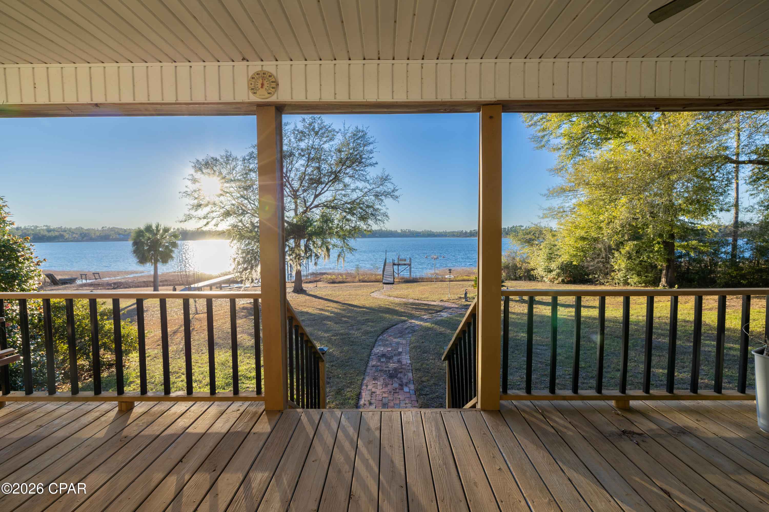 Beautiful lakefront single-family home on a full acre at the end of Seminole Lane, overlooking the pristine, spring-fed waters of Silver Lake. This 3-bed, 2-bath residence offers open living spaces, a covered porch with water views, and an entire second-story master suite for added privacy. Property features include a 2-car (20'×24') carport with an attached 20'×12' metal storage building with utilities, plus a tall 25'×12' aluminum RV-ready carport with full hook-up. Enjoy direct access to the lake from your private 82-ft dock with platform and bench, perfect for fishing, swimming, or quiet mornings on the water. Ideal as a primary residence, weekend retreat, or investment opportunity (buyer to verify rental use).
