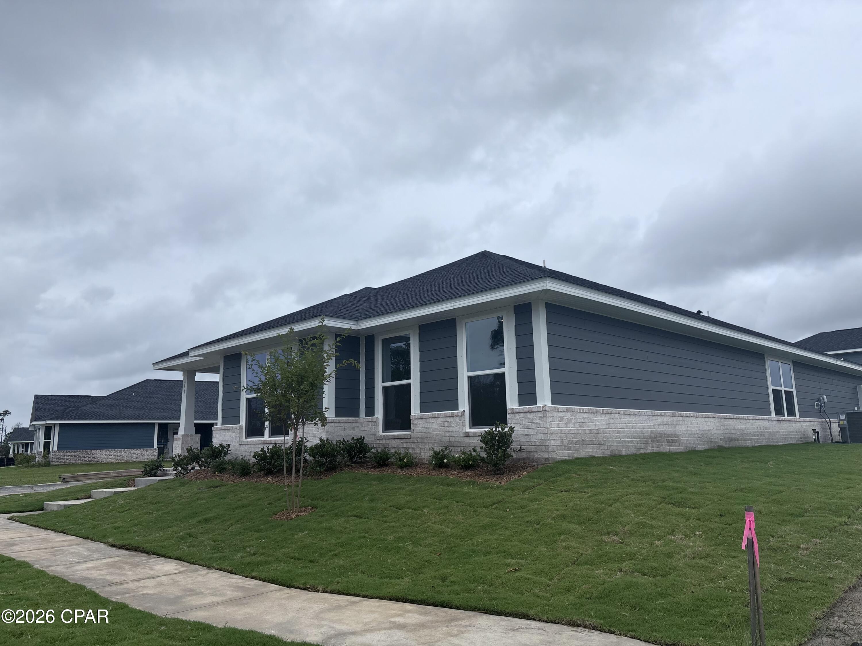 BAYFRONT COMMUNITY! LIMITED OFFER: Get a tiered rate: 2.99% (Year 1), 3.99% (Year 2), then 4.99% fixed for life. PLUS MOVE IN PACKAGE INCLUDED & COVERING CLOSING COST WITH PREFERRED LENDER!!! Step into 2,201 sq. ft. of modern elegance in this stunning 2026 single-story retreat. Located in a premier waterfront community with direct Bay and Gulf access, this home perfectly blends style with daily practicality. 
The heart of the home features an expansive open-concept living area and a chef-inspired kitchen, complete with granite countertops, a large island, and a walk-in pantry. Relax in the private master suite featuring a spa-like en-suite bath and a massive walk-in closet. Durable and beautiful Core Tec Pro Plus flooring flows throughout, offering 100% waterproof protection perfect for coastal living. With energy-efficient construction, a customizable flex room, and a 2-car garage, this home is designed for both comfort and long-term value.