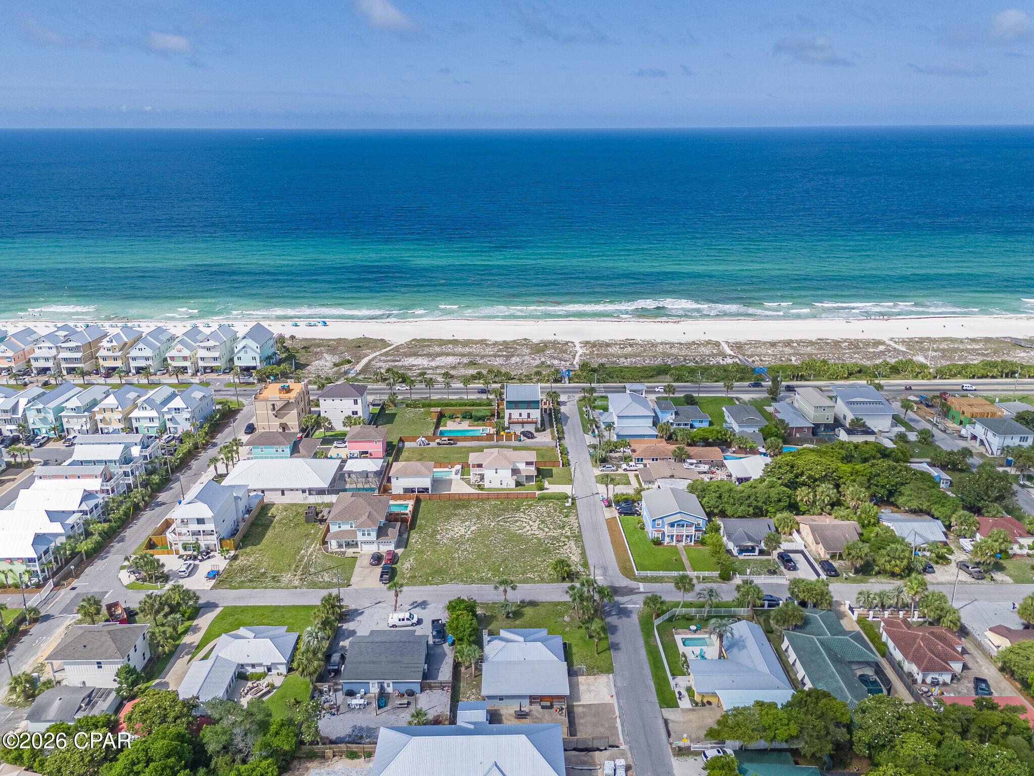 Welcome to your Beachside Paradise in the highly sought after community of Bid-A-Wee Beach! Discover the charm of this beautifully renovated 3-bedroom, 2-bath cottage, located just 100 steps from the private, gated Bid-A-Wee Beach. Sitting on the corner lot of Millcole and Albatross, this Coastal Cottage has amazing Gulf views from kitchen and living room.  With five exclusive beach access points, this home offers the perfect blend of coastal living and modern convenience. Completely Renovated: This home boasts updated features and brand new metal roof (2025). Move-in ready and designed for peace of mind! Spacious Lot: Situated on a generous 75' x 100' lot, the property offers endless possibilities. Add a carriage house, or even a pool - the choice is yours!  Large fenced-in yard that includes a spacious storage building and a private backyard oasis. Fully furnished and rental-ready, This Coastal Cottage is perfect for weekly rentals or as your personal beach retreat. Start your mornings with coffee on the front porch smelling all of the flowers and end your evenings watching breathtaking sunsets. Prime Location: •Pier Park, Top Golf, and Dolly Parton's Pirate Adventure: Less than 2 miles away •Scenic 30A: Just 9 miles away •Golf cart-friendly area with easy access to the best of Panama City Beach Bid-A-Wee Beach is a hidden gem with no HOA, offering a serene and private coastal lifestyle. Don't miss the opportunity to own this stunning beach cottage. Schedule your showing today!