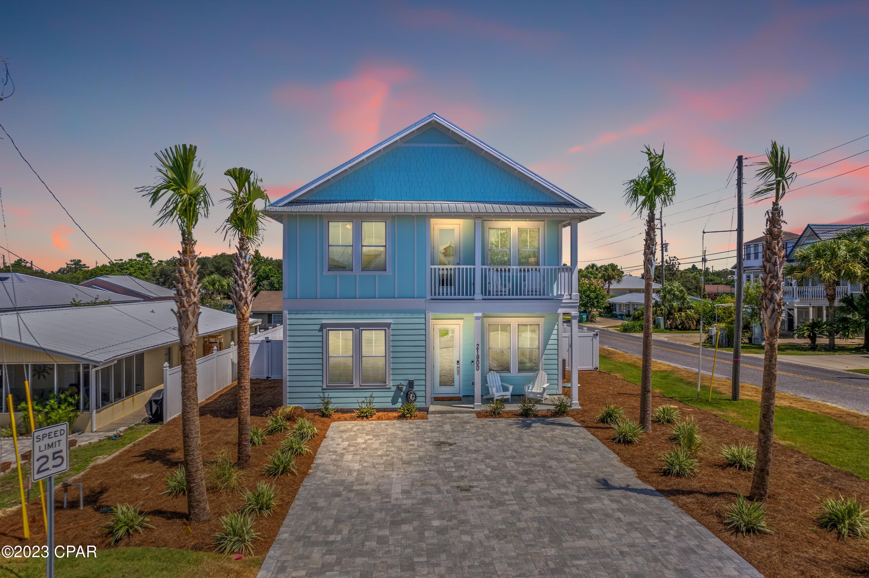 Ideal for an investor looking for amazing rental income, this stunning fully-furnished home is brand new. It has its own 24-ft. heated pool and a spacious covered patio. Due to the prime location in sought-after west Panama City Beach, just two blocks from the beach, it attracts phenomenal rental income. The beauty of buying new construction means absolutely everything is pristine from the kitchen appliances to tasteful furnishings throughout. The builder has thought of everything right down to an electric car charger, tankless hot water system and high-impact windows. Tasteful decor and a high-quality finish add to the allure of this immaculately presented beach house. The paved driveway has ample parking just steps from the covered front porch. The home is deceptively spacious with an open game room and six bedrooms including two built-in bunk rooms. It's ideal for extended families and those who love to entertain or spend time at the beach. The bright open great room has a profusion of windows and 8-ft. French doors opening directly onto the covered rear terrace and saltwater pool. There's a well-planned sitting area for watching movies or sports together and a second sitting area for quiet times. The dining area is a natural gathering place with shiplap walls and feature lighting adding delicious detail. Tall stools are lined up at the island bar ready for breakfast, cocktails and snacks. The gourmet kitchen has 42-in. Arctic white cabinets, quartz countertops and stainless appliances gleaming with newness. Practical vinyl plank flooring, a French door refrigerator and an unusual tile backsplash add to the appeal. To the rear, the private yard is fully enclosed with privacy fencing and boasts an outdoor shower. Start the day jumping in the alluring pool before enjoying a leisurely breakfast on the covered terrace. Make plans to spend the day on the beautiful white sandy beach just a short walk away or head to the shops and restaurants at nearby Pier Park.