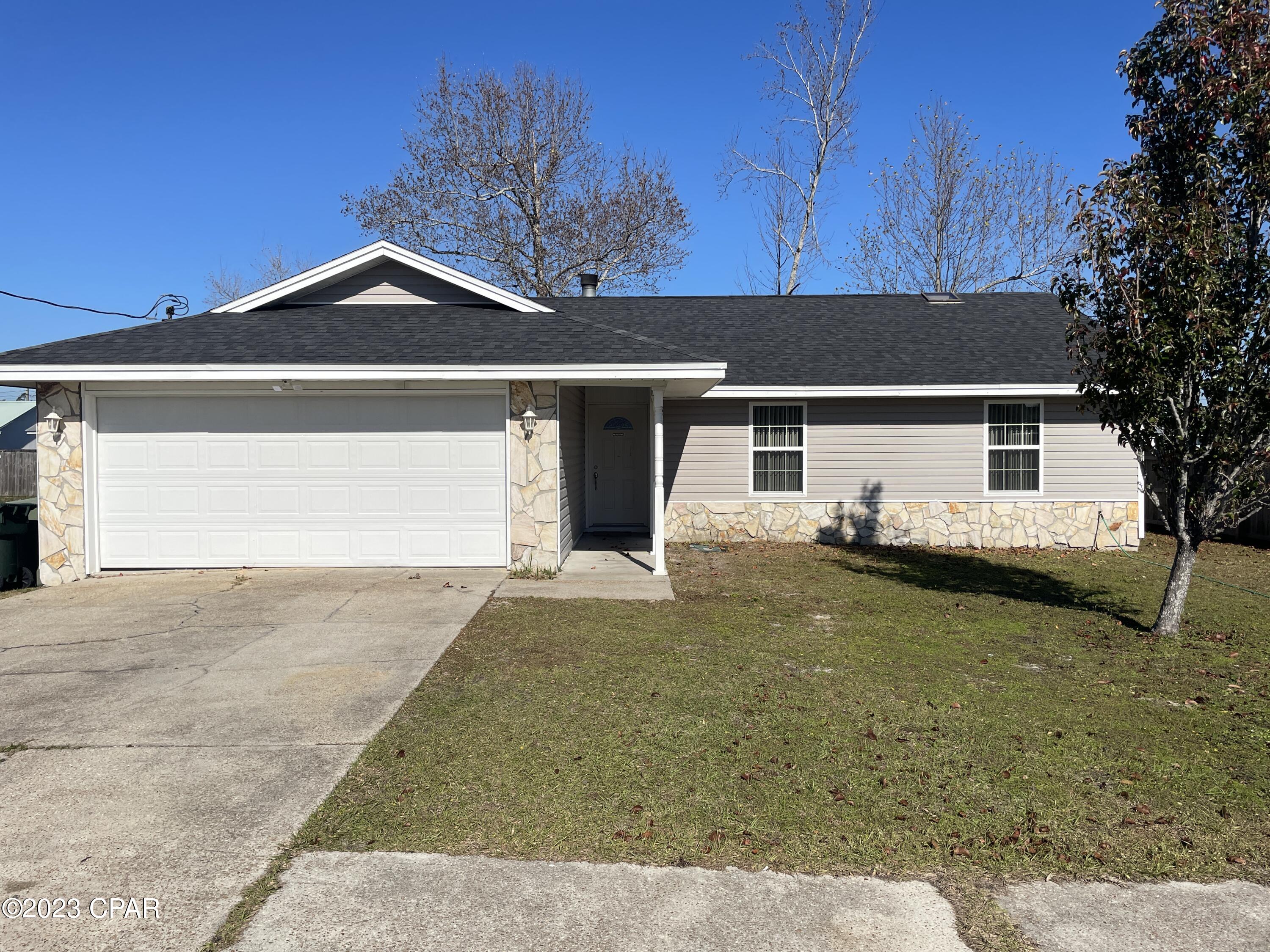 A great Lynn Haven Home 3 bed, 2 bath with 2 car garage. carpet with tile flooring. New carpet in living dining room. A nice living area with a stone fire place(decorative only) and french doors to the backyard. This is a must see, in Pine Forest Estates. No pets please.