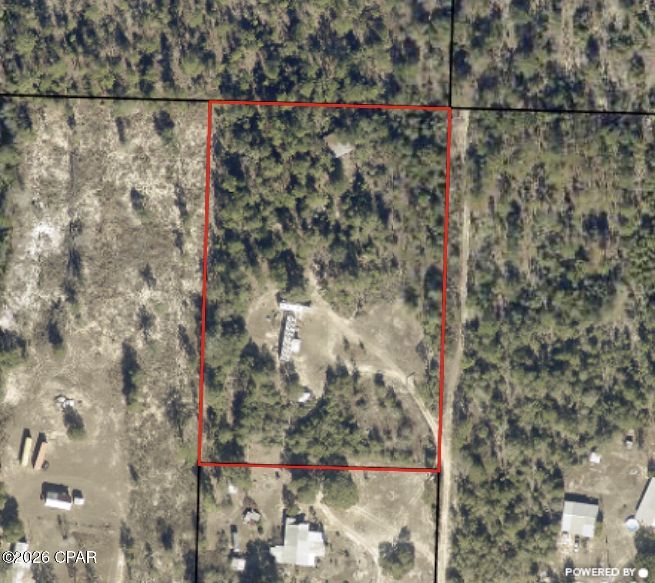 Sitting on just shy of 4 acres, this property is full of potential and ready to be transformed into your new home! The enclosed pole barn offers plenty of space for a workshop, storage, or hobby area. The property already features a well, functional septic system, and power connection in place. The manufactured home is being given no value and will require significant renovation or removal, giving you the opportunity to create the property exactly how you envision it.