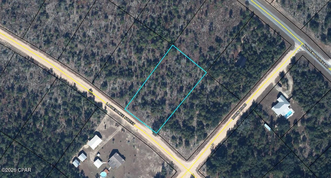 Build your dream escape in the heart of Compass Lake in the Hills! This beautiful 1-acre lot on Cherokee Street offers a prime opportunity to own a piece of Florida's natural landscape. Boasting a high-and-dry elevation with a mix of mature hardwoods and pines, this property provides the perfect blend of privacy and accessibility for your future home or weekend retreat.

As a resident of this vibrant community, you'll have access to an array of premium amenities, including private lake access for boating and fishing, a clubhouse, swimming pool, tennis courts, and more. Located just a short drive from Marianna and the world-renowned Florida caverns, this lot is perfectly positioned for those who love the outdoors. No mobile homes are permitted, ensuring a consistent aesthetic of quality site-built homes throughout the unit.