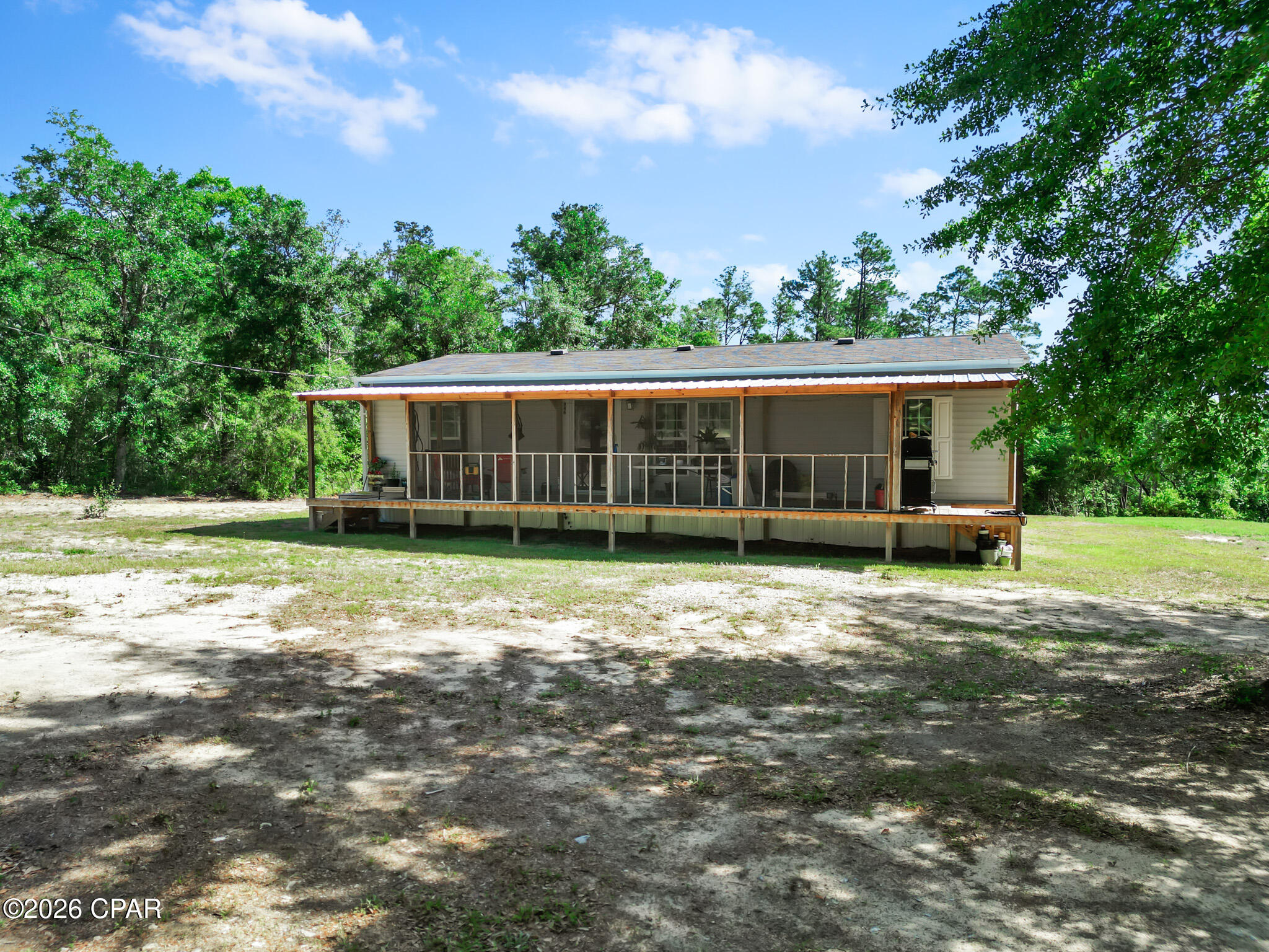 Nestled in the desirable Compass Lake in the Hills community, this well-maintained 2016 double-wide mobile home offers the perfect blend of comfort, space, and country charm. Situated on nearly 1.5 acres in Alford, this 3-bedroom, 2-bath home features 1,232 square feet of comfortable living space with plenty of room to enjoy both inside and out.



Recent additions include a brand-new front porch -- perfect for relaxing and enjoying the peaceful surroundings -- along with a new pole barn that provides excellent storage for equipment, vehicles, boats, or outdoor toys. The spacious lot offers endless possibilities for gardening, entertaining, pets, or simply enjoying the privacy of rural living.



Conveniently located less than an hour from both Panama City and Dothan, this property gives you the tranquility of country living while still being close to shopping, dining, and entertainment.



Priced at just $189,000, this property is an excellent opportunity for first-time home buyers, downsizers, or anyone looking for affordable acreage in the Florida Panhandle.



Schedule your private showing today!