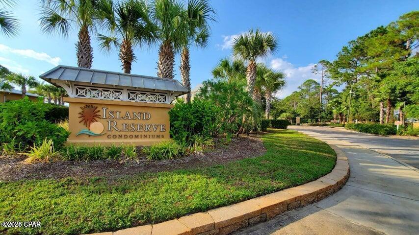 Welcome home to Island Reserve...this gated community is centrally located in the heart of Panama City Beach just a short drive to the Navy Base, beautiful gulf beaches, shopping, golf and fabulous waterfront dining as well as St. Andrews State Park!  This is the ALL ONE-LEVEL 1 bedroom plus bonus room  floorplan offering granite, stainless appliances plus washer/dryer stay! Seller added custom built-ins.  Island Reserve offers exquisite sparkling pool with waterfall, media center, indoor basketball, gym, clubhouse and hot tub!