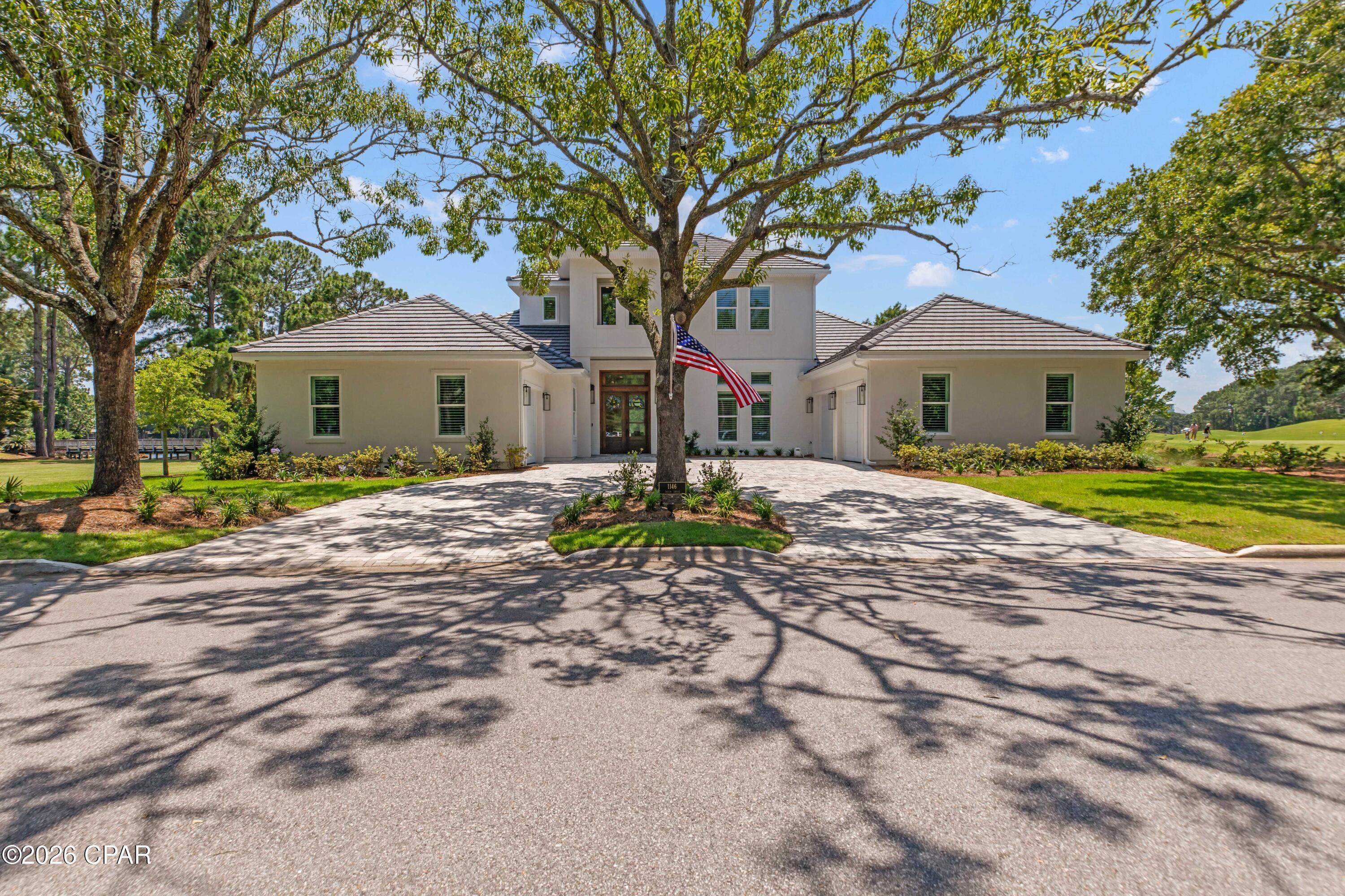 VERY RARE Opportunity to own a ONE-YEAR-OLD Stunning custom home within the award-winning gated, golf community of Sandestin! PREMIER LOCATION on the 18th green of Baytowne Golf Course with panoramic golf course and lake views. Imagine being able to take your golf cart to Grand Blvd Shops, Baytowne Marina, Village of Baytowne Wharf, and the Beach, all in just minutes. Or take your golf cart across the street to the first tee of the Baytowne or Raven Golf Course! The property is very close to back gate for easy entry and exit.  Take comfort in knowing you have the most up to date building codes. This custom luxury home was built with only best-in-class features.  Features include screened in pool/spa area with gourmet outdoor kitchen, second floor bonus room with large balcony overlooking golf course, large master suite with double vanities and walk in shower, open floor plan with top-end quartzite countertops, custom cabinetry, 12-foot ceilings, impact windows and doors, whole home generator, private dock, and fenced yard. Open kitchen concept includes dining nook and large island. Abundant storage throughout the home. Seller is open to offering the property fully furnished. White sandy beaches are within a mile. You won't find another home this age of this quality in all Sandestin. It won't last long! Buyer to verify all fees and dimensions.