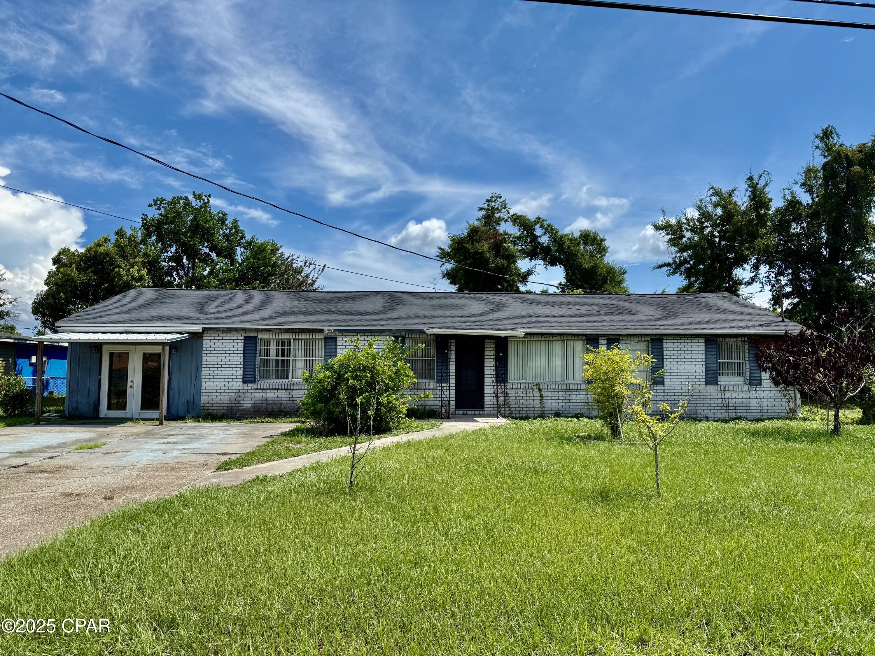 Back on market due to no fault of Seller.  Spacious three bedroom two bath Rancher on large lot with rear yard access with shop and storage buildings.  This home features a large Living Room, Den, roomy Kitchen and Formal Dining Room.  Home is a fixer upper and in need of some minor repairs throughout.  If you are looking for an affordable home that needs some repairs, then this is it!  Perfect for the handyman buyer or fix as you go buyer.  Great home for rental portfolio or fix and flip.  Home is being sold AS-IS.  Roof was replaced in November 2021.  The Master Suite addition has a rolled shingle roof covering that was lifted and caused a small water leak that needs repaired.  Roof covering pulled back over to cover the roof but not secured to roof decking.  Rolled shingle roof over addition will need to be replaced.  See photos.