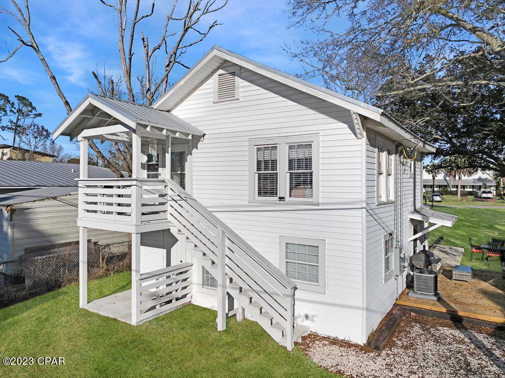 CURRENTLY UNDER CONTRACT, SELLER WILL CONSIDER BACKUP OFFERS. BEAUTIFULLY RESTORED 3BR/2BA HOME W/BAY VIEW JUST MINUTES TO DOWNTOWN PORT ST JOE! This 2-story charmer has been transformed w/a kitchen, dining & living room on each level. Consider this as your vacation getaway or wisely invest in an income producing long term rental. Located on a quiet street, you'll enjoy the outdoor lounge area, covered porches & the extended driveway for boat parking. Golf cart transportation is all you need to visit family owned businesses & shops for fresh seafood, live entertainment & local artistry. The Forgotten Coast attracts boating & fishing activities from locals & tourists alike. Preparations are underway for a state of the art dry storage facility to hold an impressive 252 boats! Take the 3D tour & call for a showing today!
