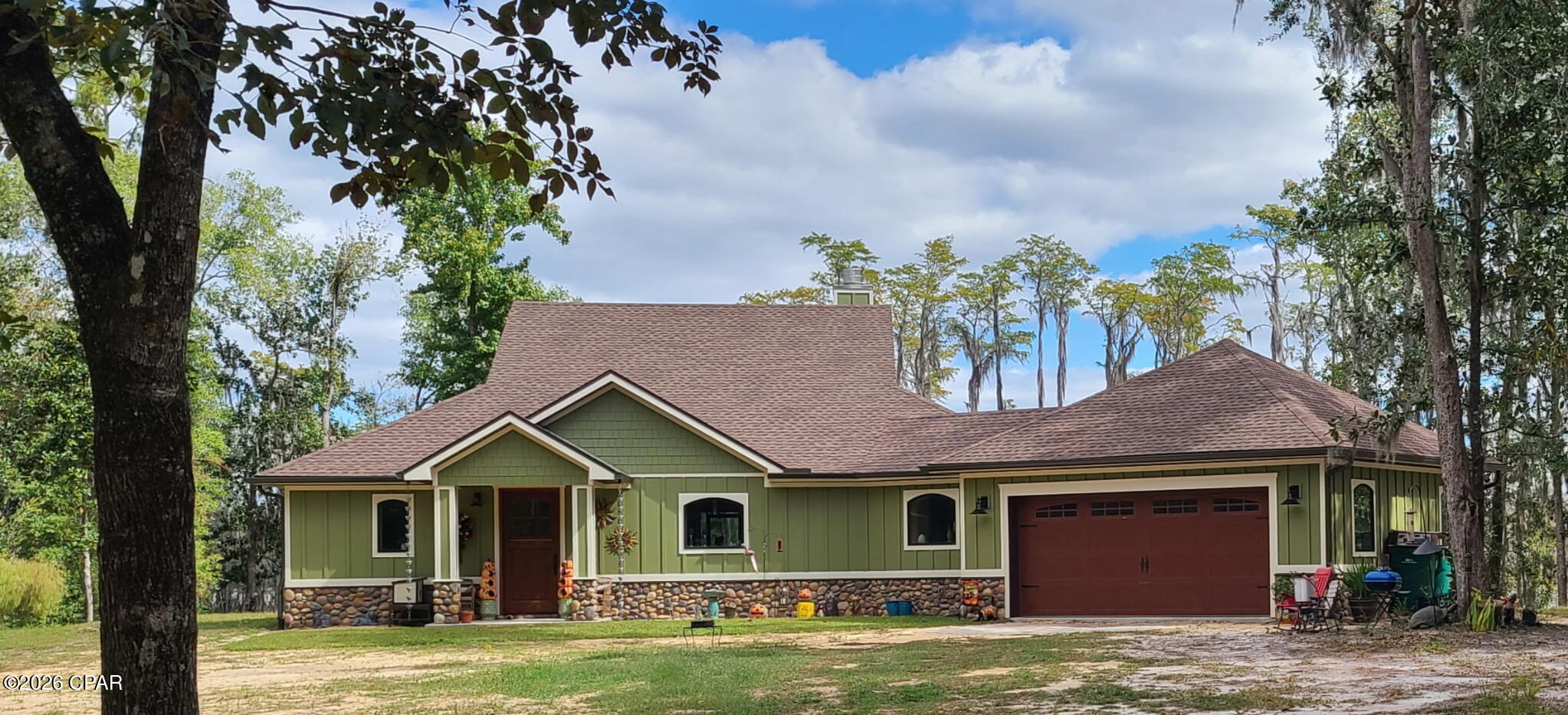 Custom, ICF CONSTRUCTION, WATERFRONT home with acreage located in Paradise Lakes, Washington County Florida- 2BR/2 Bath -1848 sq feet/3030 sq ft under roof. 3.57 acres+/- of Dunford Lake water frontage....There are 4 contiguous lots at this homesite, but the GARDEN lot has has no structure could easily be SOLD as a vacant, buildable lot...Exterior of Home- CRAFTSMAN look and feel with 36 inch river rock stone border to include columns of front porch with Hardi brand board & batten around the full exterior, Roof deck(attic) sprayed with 6 inches of open cell spray foam- Andersen A- series, picture style windows cased in  oak, windows wet flashed with Prosoco wet flashing, Andersen A- series doors with multi point locks cased in oak, Larson Mahogany 42 inch solid wood front door, 3ft wood sea wall, Haas 664 Mahogany Bi-directional grain, 6 pane garage door with arched windows and hurricane rated with handles and hinges-6 inch seamless gutters around perimeter of house, huge screened in back porch 10x50 which stretched full length of the home (waterfront)...Geo- technical boring done on site to insure suitable, stable ground for the Construction of the home..Interior of Home- Living Room features a huge, Stone accent, Wood burning fireplace with Gas log lighter, built in oversize book cases, 6x8 ft picture window, access to back porch, open and spacious Kitchen features Z line appliances to include 7 burner gas cooktop, double ovens, 45'' single bowl stainless z line sink, and a drawer style microwave, Zephyr flush-mount exhaust hood, Frigidaire Gallery 29 cu ft refrigerator, built in custom cabinets, oversized 6x9 Quartzite Island, open and spacious Guest Bath features skirted Kohler soaker tub, curb less, walk in shower and features Schluter system waterproofing membrane and floor pans,, double vanities with Kohler undermount, oversized sinks, and Kohler ride height toilet, ceiling fan (Fandelier) Guest bedroom-features French door entry to back porch, waterfront view Master Bedroom- features French door entry to back porch, waterfront view Master Bath-features curb less, Walk in shower with custom stonework and features Schluter system waterproofing membrane and floor pans, double vanities with Kohler undermount, oversized sinks, and Kohler ride height toilet, oversized dressing counter with chair, linen closet, ceiling fan Laundry/mud room- oversized canning pantry and mechanical closet located in this room, built in mop/hand sink, hanging space for laundry, built in storage cabinets to include a day bench Extras and upgrades-Custom reclaimed oak engineered wood flooring 8'' wide planks, Custom trim work throughout house, Interior doors are 8' solid wood doors, Cypress tongue & groove ceilings, custom cabinetry throughout the home, 10 foot ceilings, oversized canning pantry, Granite and Quartzite counter tops throughout, HUGE Garden- 60x 120 - soil tested twice a year, blueberry bushes, pear trees, peach trees, blackberry trellis, orange trees, lemon tree, and muscadine arbor.- electric fence Pole barn- fully permitted 24x36 12' eaves pole barn residential concrete slab, upgraded 26 gauge metal roof/walls, fully wired to include 30amp outlet barn has been sprayed with closed cell insulation roof/walls also has 2 10' wind rated roll up doors...Extra Features - 22 KW Generac whole house generator with transfer switch, deep well with water filter system and water softener system, 250-gallon Propane tank, RV parking access spot with ramp