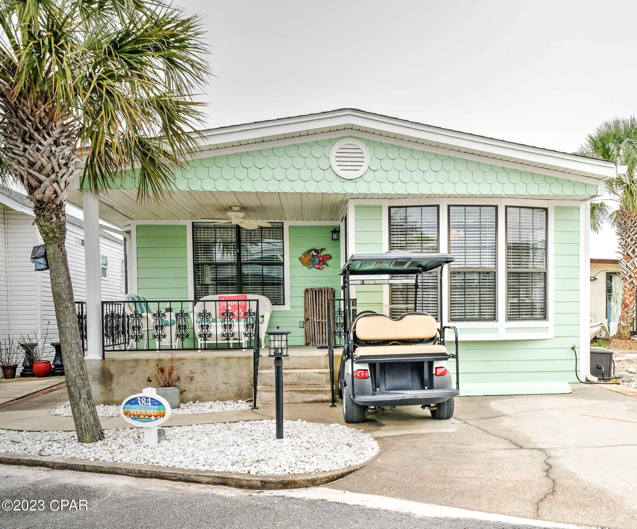 Check out this beautiful 2 bedroom, 2 bath in highly desirable Venture Out! This adorable home has an open floor plan and has a great beachy vibe. All the rooms are a good size and the home flows beautifully from room to room. Enjoy afternoons on the fabulous front porch that offers plenty of room for grilling and relaxing after a long day on beach. It doesn't get better than this! Venture Out is a golf cart community that has 300' on the beautiful pristine beaches of the Gulf of Mexico and 1,000' on the Grand Lagoon. Venture Out has something for everyone. With two pools (one heated), fishing pier, boat ramp, mini golf, children's playground and much more.