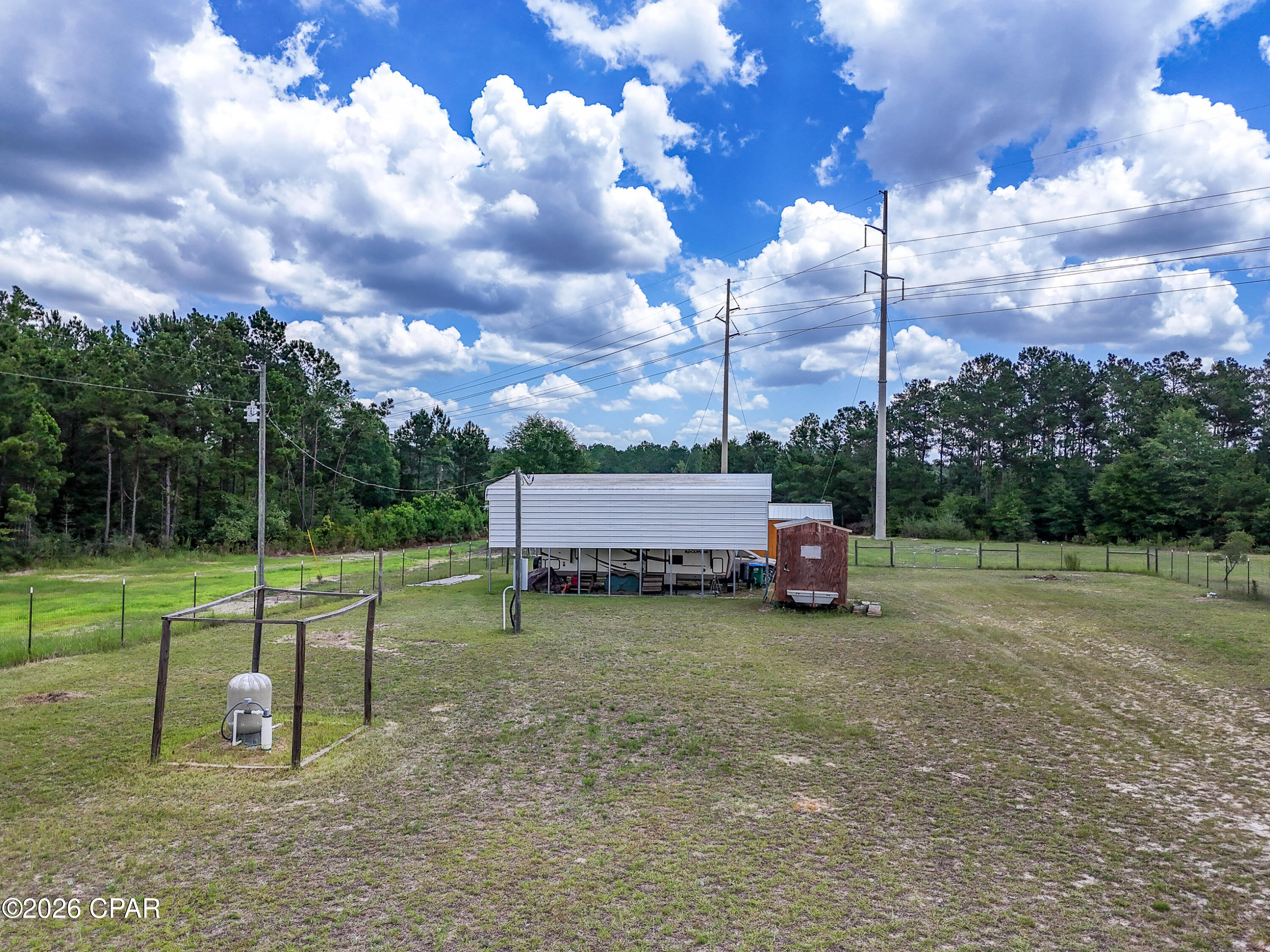 Welcome to your own slice of lakefront paradise at 422 McDuff Drive, Alford, FL! Situated on 2.5+/- acres, this cozy 1-bedroom, 1-bath home offers peaceful waterfront living with plenty of room to relax and enjoy the outdoors.

The property features a fenced yard, making it ideal for pets, gardening, or simply enjoying your private space. A covered RV parking area provides convenient storage for your camper, boat, or recreational vehicles. As an added bonus, a 1-bedroom camper conveys with the sale, creating extra space for guests or additional lodging options.

Located in the quiet community of Alford, you'll enjoy the serenity of country living while remaining conveniently close to everyday amenities. The property is approximately 35 minutes from Interstate 10, providing easy access for travel, and about 45 minutes from Panama City Beach, where you can enjoy world-famous white-sand beaches, dining, shopping, and entertainment.

Whether you're looking for a weekend getaway, a full-time residence, or a lakefront retreat with room to spread out, this unique property offers a rare opportunity to enjoy Florida's natural beauty and relaxed lifestyle.