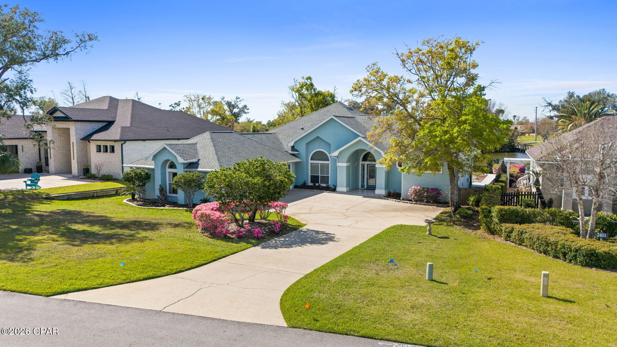 Welcome to 2407 Willow Lane in Lynn Haven, a beautiful 4-bedroom 3-bath, 3-car garage lake front home located inside the Panama Country Club golf community.  Perfectly positioned on Willow Lake and overlooking the #7 hole of the Panama Country Club golf course, this property offers peaceful water views and scenic fairway surroundings.  

Designed with a split floor plan, this home provides both privacy and functionality, making it ideal for families or those who enjoy hosting guests.  French doors open to a covered veranda overlooking the fairway and lake.  A private dock extends to Willow Lake, creating a true indoor-outdoor lifestyle.  The spacious layout features generous living areas, abundant natural light, and stunning views of the lake and golf course from multiple rooms.  Enjoy morning coffee or evening sunsets with tranquil lake and golf course views.  

Granite countertops, stainless steel appliances, and established landscaping enhance security for pets and gatherings while maximining the view.  Located in the highly desirable Panama Country Club area of Lynn Haven,  this home is just minutes from shopping, dining, parks, and the top Bay County Schools, while still offering the quiet atmosphere of a golf and waterfront community.

Golf. Water. View. Privacy.

If you're searching for a golf course home, lakefront property, or Panama Country Club real estate in Lynn Haven, this property is a must see.