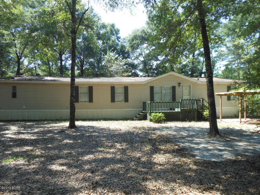 CONGRATULATIONS ! By reading this you have a unique opportunity to purchase this move in ready home, on a large, beautiful, corner lot, that's also close to Deer Point Lake !  You've finally found the affordable home of your dreams! Just wait until you pull up in the driveway and look around the wonderfully tree shaded lot. In front there is a covered and bricked area that's just perfect to relax in after a hard day of fishing in Deer Point Lake. There is a large, 20x12 storage building for all of Dad's yard and fishing toys. There's even a smaller building that would be perfect parking for a yard tractor!  We didn't forget the kids and the family dog. This huge yard has a large, fully fenced area all around the home for the kids and dog to run and play! When you enter the front door, you'll will be delighted in trying to figure out where to put you big screen tv and all your furniture in this huge 25 foot long living room !  Mom will enjoy seeing the kitchen and will instantly realize she finally has tons of cabinet and counter spaces.  The whole family will enjoy the large den featuring a wood burning fireplace for those cozy, winter nights ! The master bedroom, which by the way, is at the opposite end of the home from the kids rooms, has his and hers walking closet. Open the double doors and you will immediately see the large, master bath that has a skylight over the garden tub. Allow plenty of time to see this home and property.  There is much to see and has something for everyone in the family !!!  The home is being offered as is with the right to cancel the contract based on any home inspection that may be deemed to be unsatisfactory.