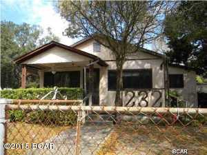 What a buy on this large sq ft home with 4 bedrooms for that large family, front porch to sit and watch the kids play, enclosed sitting area off of master bedroom great area for moms quiet time, and we didn't forget dad with a detached garage/workshop with electric.  Conveniently located to Tyndall AFB, hospital and all other amenities in area.  Needs flooring and paint to make this home your own.  Call your friendly agent today to see this home.  Won't last long at this price.