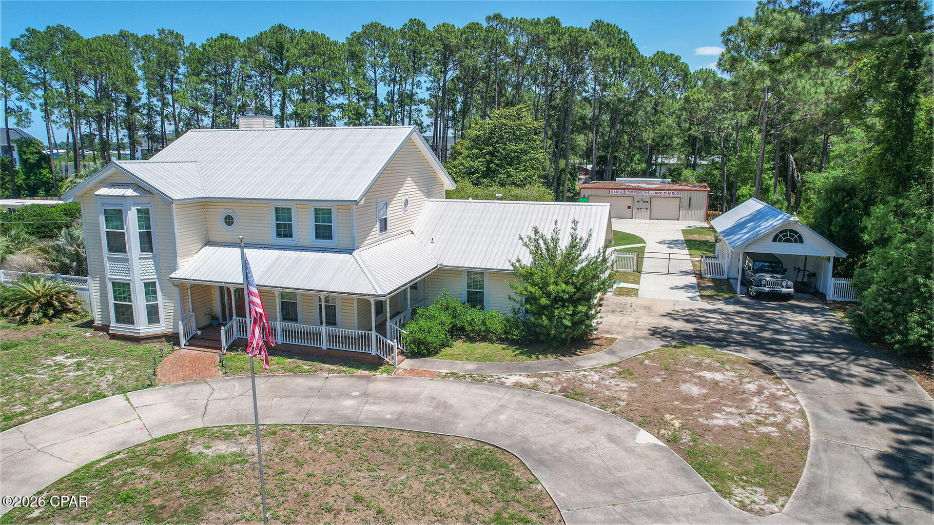 You've found it! Privately gated 1.19 acres, 6 bedrooms, 4,458sf, and no HOA on the east end of Panama City Beach.  Located not far from the US Coast Guard Station, shopping and restaurants. This home is an easy golf cart ride to the white sandy beaches and emerald coast waters known as the Gulf of America.  Enjoy the grand circular drive with parking for approximately 20 cars; extra-large front porch; single car detached garage; 75' heated lap pool; and an additional oversized 3 car garage/workshop/workout/game room. The mature trees and landscaping create a peaceful slice of paradise that you will treasure.  Terrific as a professional retreat, family vacation home or residence. Recent property updates can be found in the MLS ''Documents'' tab.  The interior of this home includes 6 bedrooms, office space, 2.5 bathrooms with a bonus comfort room near the mud room that includes a shower and sink.  The kitchen and living room spaces are open and work naturally in combination with the back patio/pool deck.  Perfect for entertaining a group of friends or a happy family.   This home is equipped with a Generac whole home generator.  Reach out to your favorite Realtor to set up a showing today!