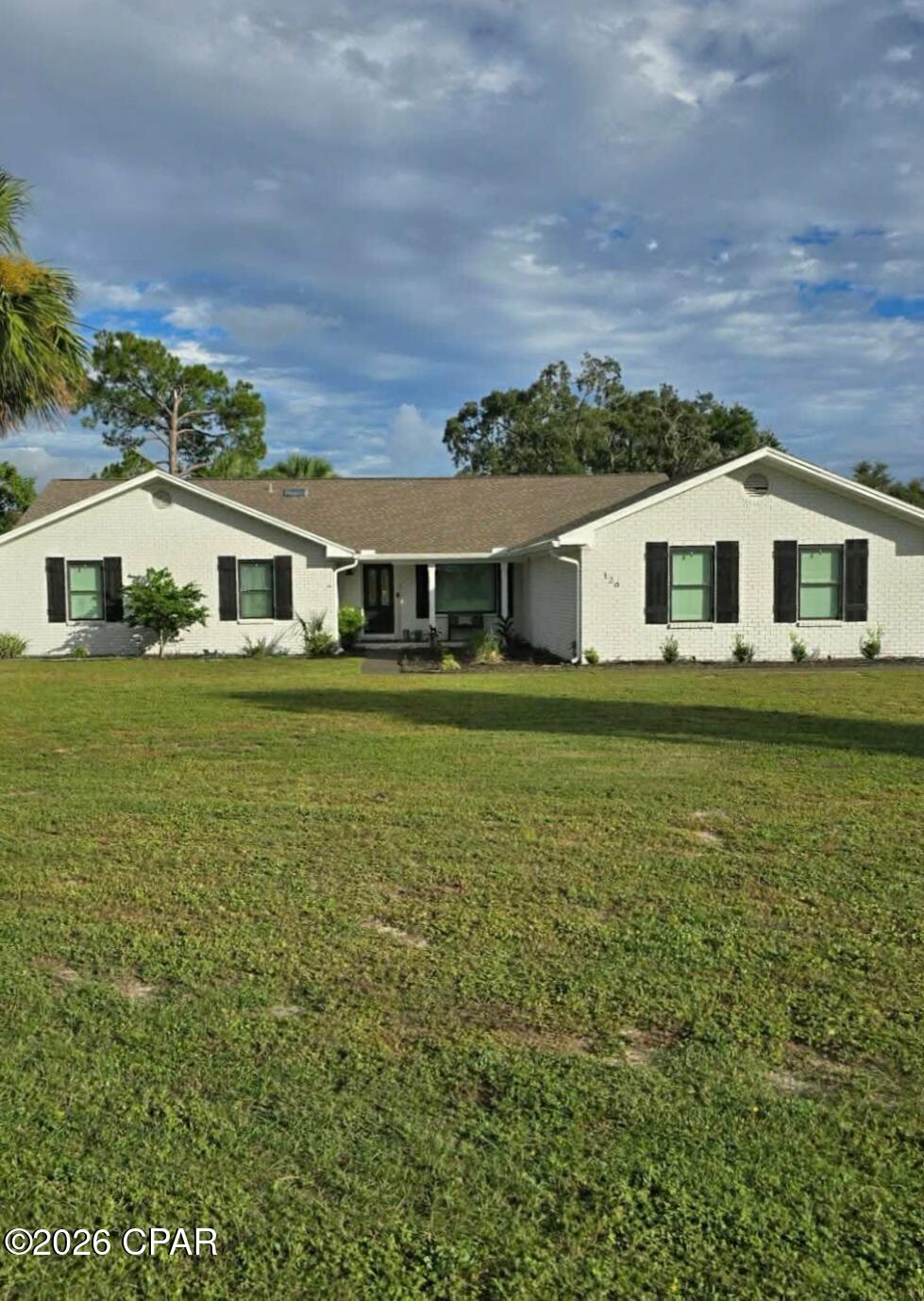 Price adjustment! Seller will assist Buyer by contributing to a buy down or toward closing costs!  Dont let this opportunity get away! 
Gorgeous 4 side brick ranch with an in-law suite! This home has it all! Main house has 4 bedrooms and 2.5 baths. The Kitchen offers quartz countertops, center island for tons of storage and workspace. Love to bake? The double ovens will be a great help! The cooktop offers both electric and convection cooking. Lots of cabinet space and a pantry with slide outs. The dining room can accommodate up to 12 and the breakfast bar is perfect for additional seating. You will love the open floor plan with a very large family room with beautiful fireplace. The ceiling in the family room is tongue and groove and the ceiling height makes it perfect for that oversized holiday tree. The Master bedroom is large enough to hold a king size bed and still have a sitting area. The master bath has  been upgraded to a gorgeous shower, double vanities, double closets and beautiful lighting.  There are 3 additional bedrooms in the main house and a bath and a half. The  in law suite offers approx. 950 sq feet with a living room, kitchenette, bedroom and full bath. There is a sunroom between the main house and the in law suite that is perfect for a reading room or even for plants! Step outside to the huge inground pool deck and covered patio. The pool is large and inviting. Don't forget to check out the covered boat slip with boat lift on the canal. There is even a tree house in the beautiful and enormous oak tree. The home is on a double lot and it fenced for privacy. There is also a separate work shop to hold all your garden and lawn equipment. The upstairs of the shop is perfect for storage. Make sure to put this home on your must see list!