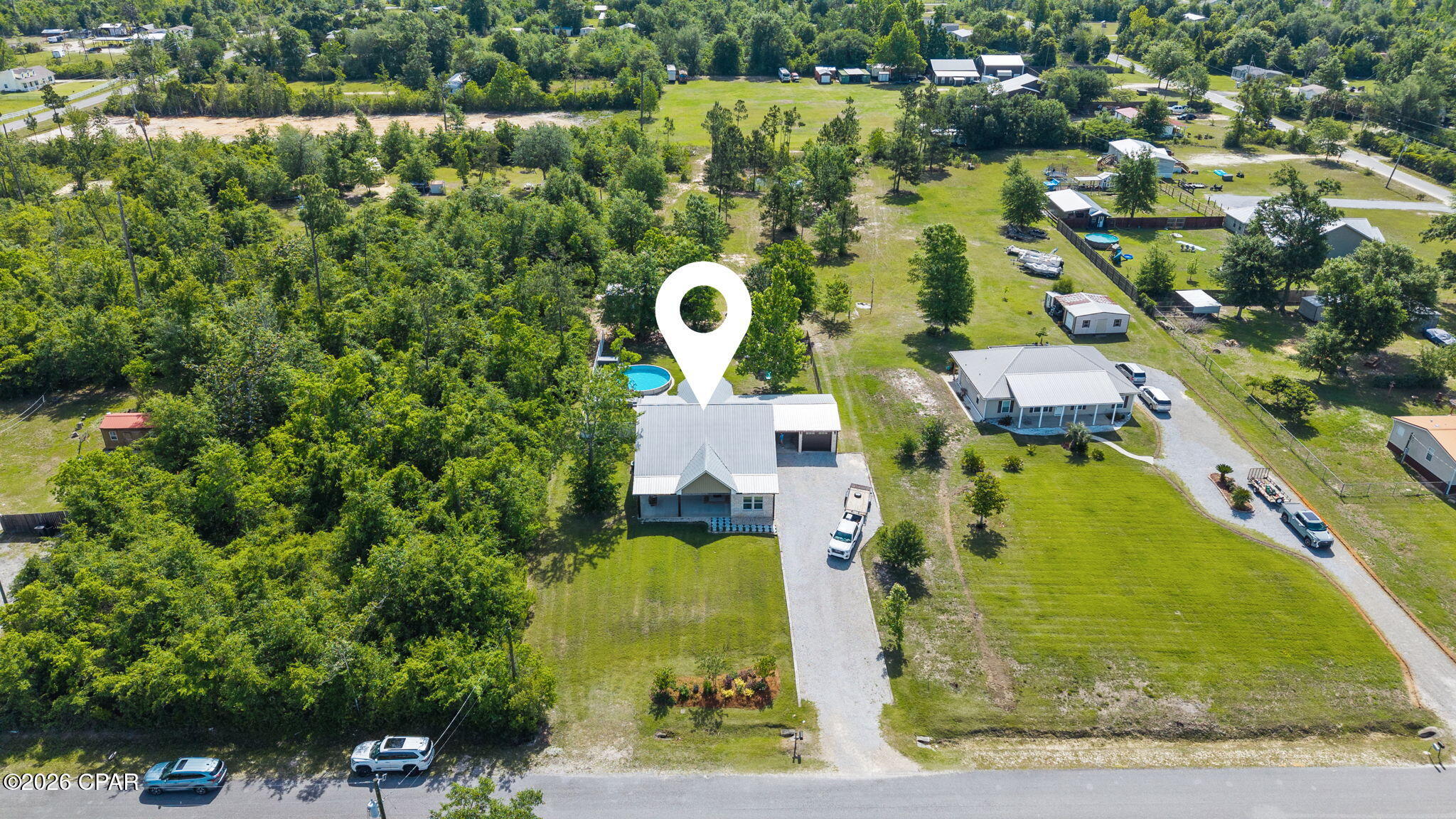 Welcome to your own private slice of country paradise where peaceful living meets modern comfort, all just 10 minutes from town. Situated on 1.34 acres with a beautiful pond backdrop, this property offers the kind of freedom and lifestyle that's getting harder to find. With no HOA, there's plenty of room to enjoy the outdoors, ride side-by-sides, 4-wheelers, and dirt bikes, or simply spread out and enjoy the privacy.

Built to last with a brick exterior and metal roof, this home combines durability, comfort, and timeless appeal. Inside, the thoughtfully designed split-bedroom floor plan features 3 bedrooms on the first floor, creating both comfort and privacy for everyday living.

The kitchen was designed with both style and practicality in mind, featuring beautiful finishes, plenty of workspace, and a gas stove perfect for anyone who loves to cook and entertain.

The spacious primary suite feels like a retreat of its own with a spa-inspired bathroom featuring a deep soaking tub, a large walk-in shower with both a rain shower and regular shower head, and the perfect setup to relax after a long day.

Upstairs, you'll find a large bonus room that could easily function as a 4th bedroom complete with a large walk-in closet or office space. This flexible area would also make the perfect man cave, game room, media room, playroom, or hobby space depending on your needs.

Step outside to a large covered back porch with plenty of room for outdoor furniture and future outdoor kitchen space, all overlooking the backyard oasis. The newer pool and pool deck are designed for easy maintenance so you can spend more time enjoying and less time working. Between the pool, pond, and open space, the backyard delivers the ultimate country lifestyle that will make you never want to leave home.

Additional features include custom mudroom cabinetry for extra storage and organization, plus a laundry room straight out of TikTok, stylish, functional, and designed to make everyday tasks feel a little more enjoyable.

If you've been searching for a property that offers space, freedom, and a lifestyle you can truly enjoy, this one checks all the boxes.