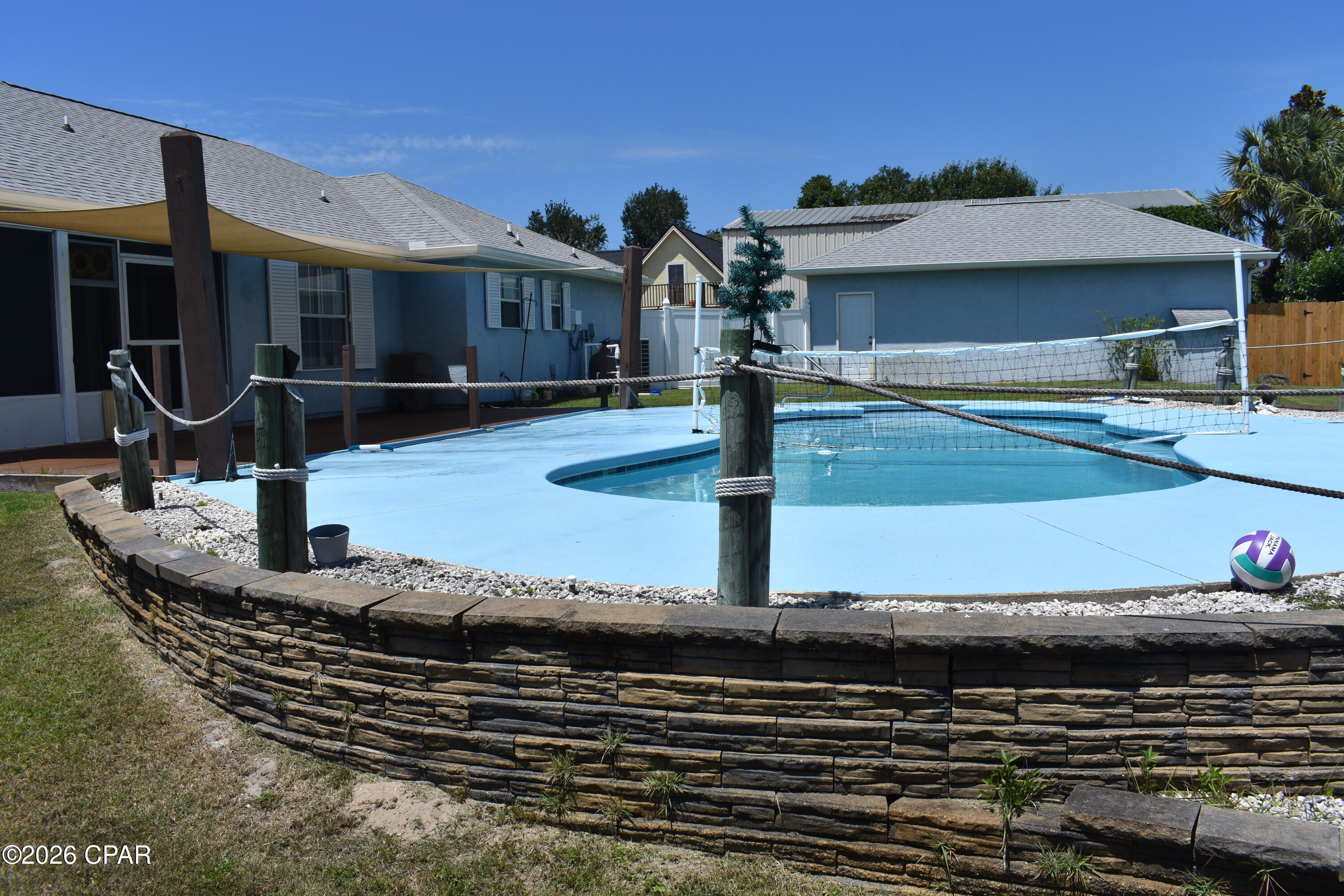 West End Panama City Beach Gem - Short walk to the beach, Large lot, Oversized detached garage, No HOA, and Private Pool
Properties with a combination of beach proximity, easy access to the 30A corridor, no HOA, a large lot, and an oversized detached garage/workshop are increasingly hard to find on the desirable west end of Panama City Beach.
Inside, you'll find updated flooring and bathrooms, 2 walk-in closets, gas fireplace, a safe room, a clean and inviting interior, and a move-in ready layout that allows you to start enjoying the coastal Florida lifestyle immediately.
Step outside to your backyard retreat through the screened-in porch featuring a shaded composite deck, saltwater sports pool and privacy fencing--perfect for entertaining, relaxing, or enjoying year-round outdoor living.
A standout feature is the oversized 20' x 30' detached garage which provides ample space for vehicles, boats, golf cart, workshop needs or additional storage.
Just a 3-minute golf cart ride to the beach, you'll enjoy easy access to the sugar-white sands and emerald waters of the Gulf while still having the comfort of a spacious residential setting.
Whether you're looking for a primary residence, second home, or investment property, this home checks all the boxes.
Property Features:
• Updated bathrooms and flooring
• 2 Walk-in closets
• Gas fireplace
• Safe Room
• 115' x 125' Lot
• Large 20' x 30' detached garage/workshop
• Screened-in porch
• Water softening system
• Attic
• No HOA
• Move-in ready
• Sprinkler System on well
• Private saltwater swimming pool
• Hurricane shutters
• 2-year-old roof      
• Shaded composite deck
Location Highlights:
• Short walk or golf cart ride to the Gulf's sugar- white beaches  
• Approximately 10 minutes to Pier Park
• Convenient access to the scenic 30A corridor
• Close to shopping, dining, entertainment, and outdoor recreation
• Quiet west-end location with excellent accessibility
This property is offered in as is condition.
Schedule your private showing today and experience the perfect combination of privacy, convenience, and coastal living.