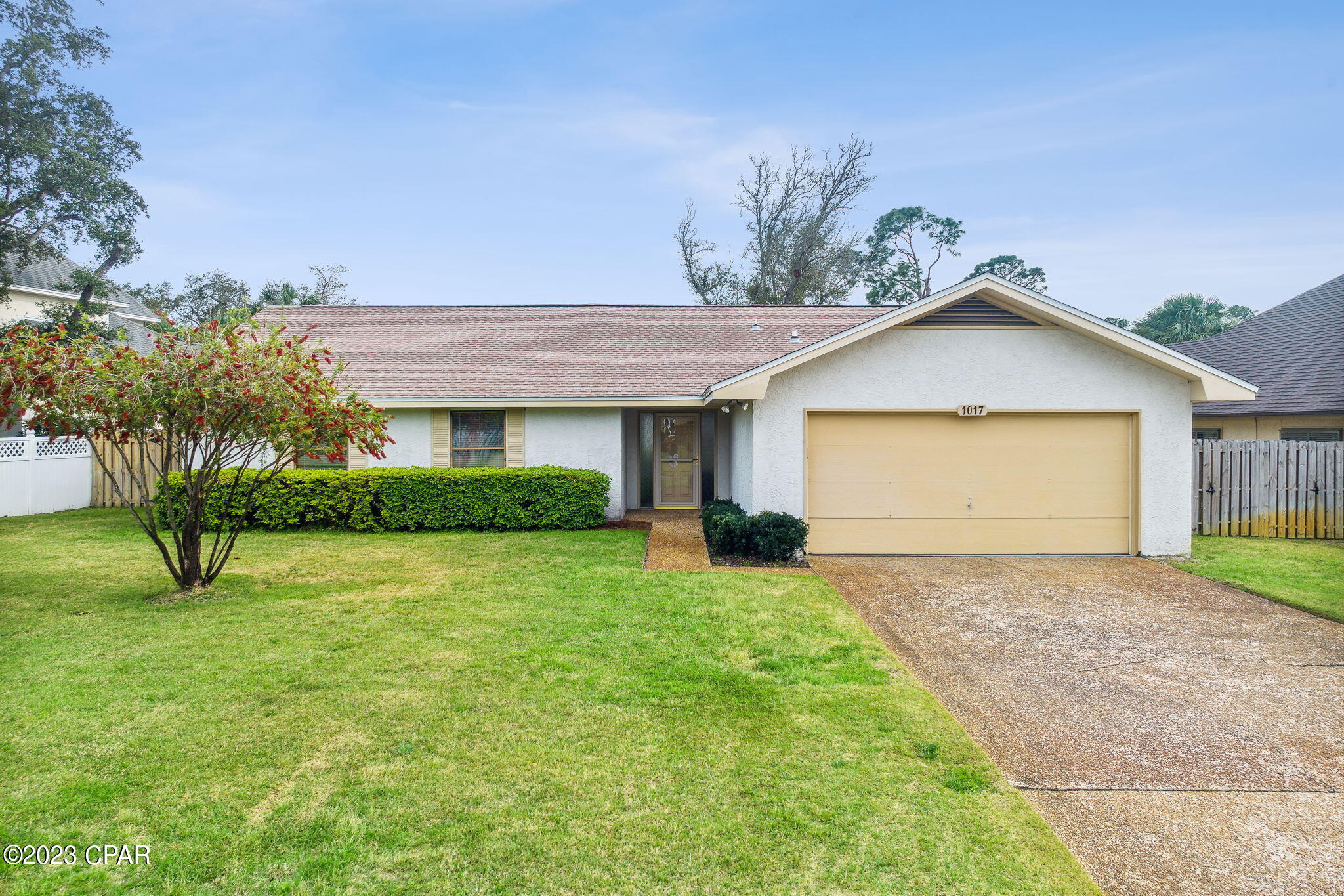 Bay Point Gated Community! This well maintained ranch style home located in one of the most desirable neighborhoods in Panama City Beach is a winner! This wonderful home has been a second home for the seller since it was built, 3 bedrooms with 2.5 bathrooms features a large kitchen with Island, tile in all wet areas, WW carpet in the living area and bedrooms, a vaulted living room ceiling with beam, The master bedroom has two closets, and an ensuite. The home comes fully furnished with Mid-Century Modern style furniture. There is a very nice screened porch just off the dining room and a small patio outside for entertaining or that morning cup of coffee. The home backs up to greenspace, no neighbors directly behind. There is a a working central Vac, finished garage, sprinkler system on well New Roof in 2019