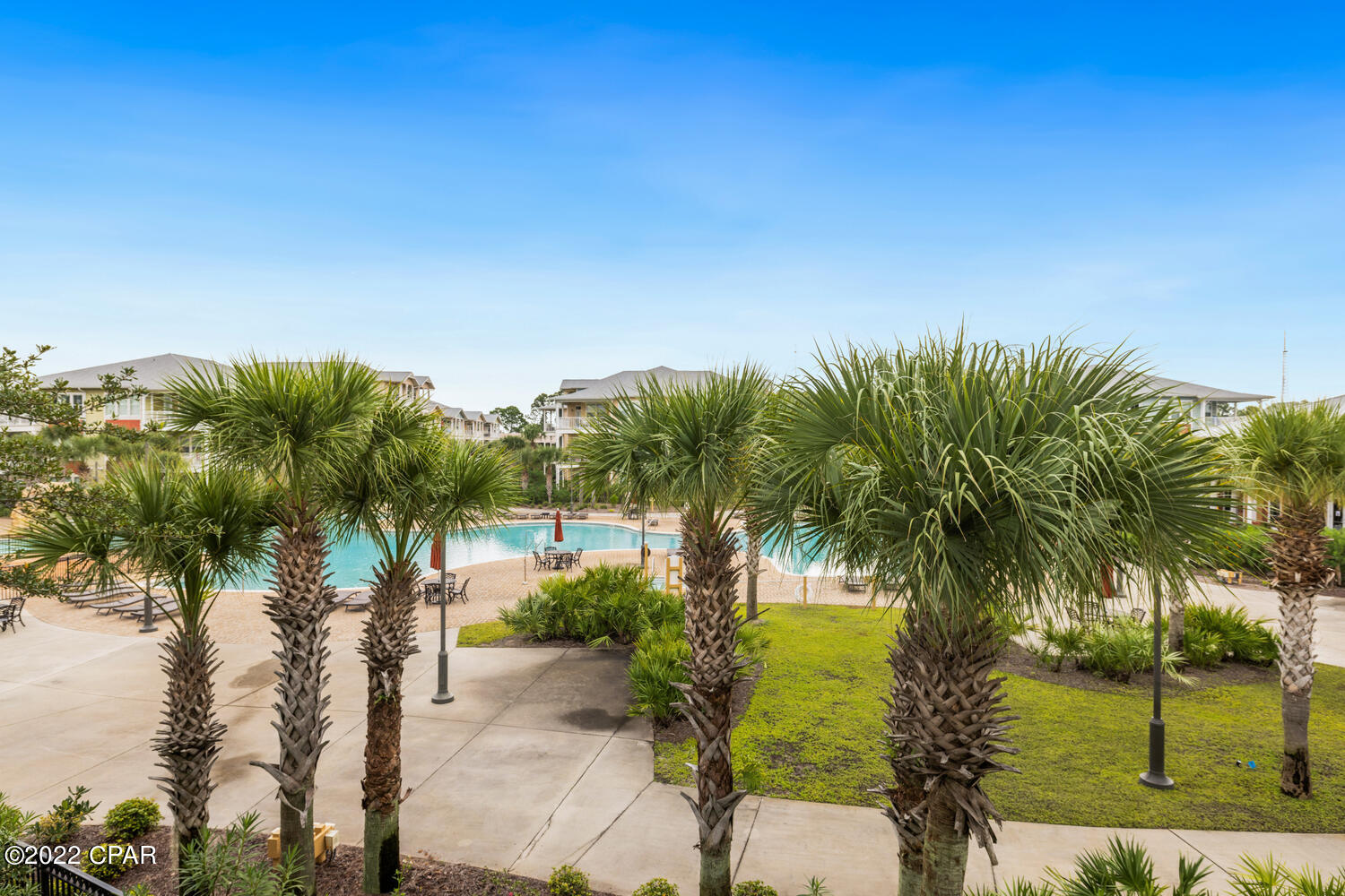'CURRENTLY UNDER CONTRACT, SELLER WILL CONSIDER BACKUP OFFERS'.  A PRIME UNIT OVERLOOKING AN ACRE ISLAND POOL DOES NOT BECOME AVAILABLE OFTEN.  HERE IT IS!  Welcome to the lifestyle of Island Reserve.  Great community with lot's of activities throughout the year.  Close to the beach! This open floor plan is wonderful & spacious with lot's of kitchen cabinets & pull out drawers. Other features include granite counters, under counter lighting, SS appliances & a new refrigerator! Split bedroom plan offers your guests their own private suite.  Relax on the wrap around porch overlooking a beautiful pool with waterfalls, courtyards with fountains, and so much more!  Pickle ball, basketball, full gym equipment, community room with pool table & a theater room.  Lot's to do at Island Reserve.